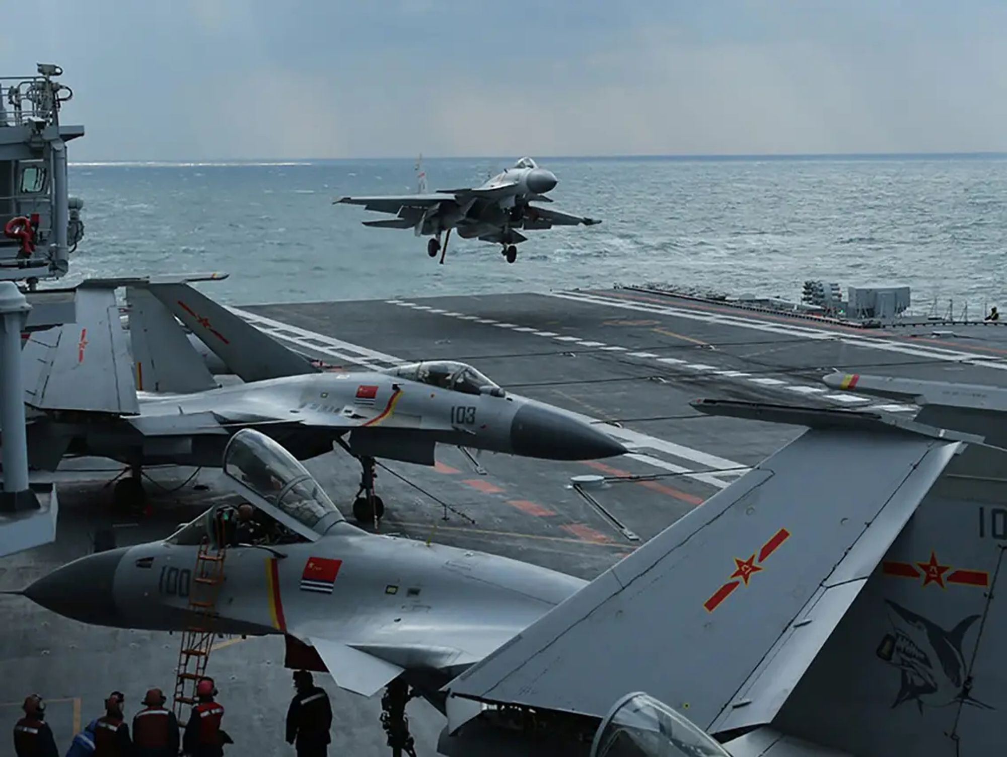 J-15 lands on Liaoning, with others parked around the flight deck