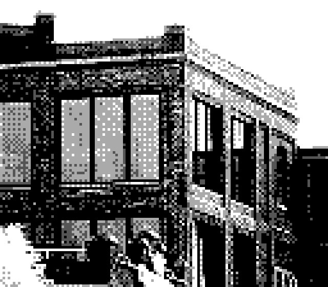 A black and white Game Boy Camera photograph of a faraway corner of a building. It depicts tall windows  of the upper two stories with a bright tree or bush on the lower left corner. 