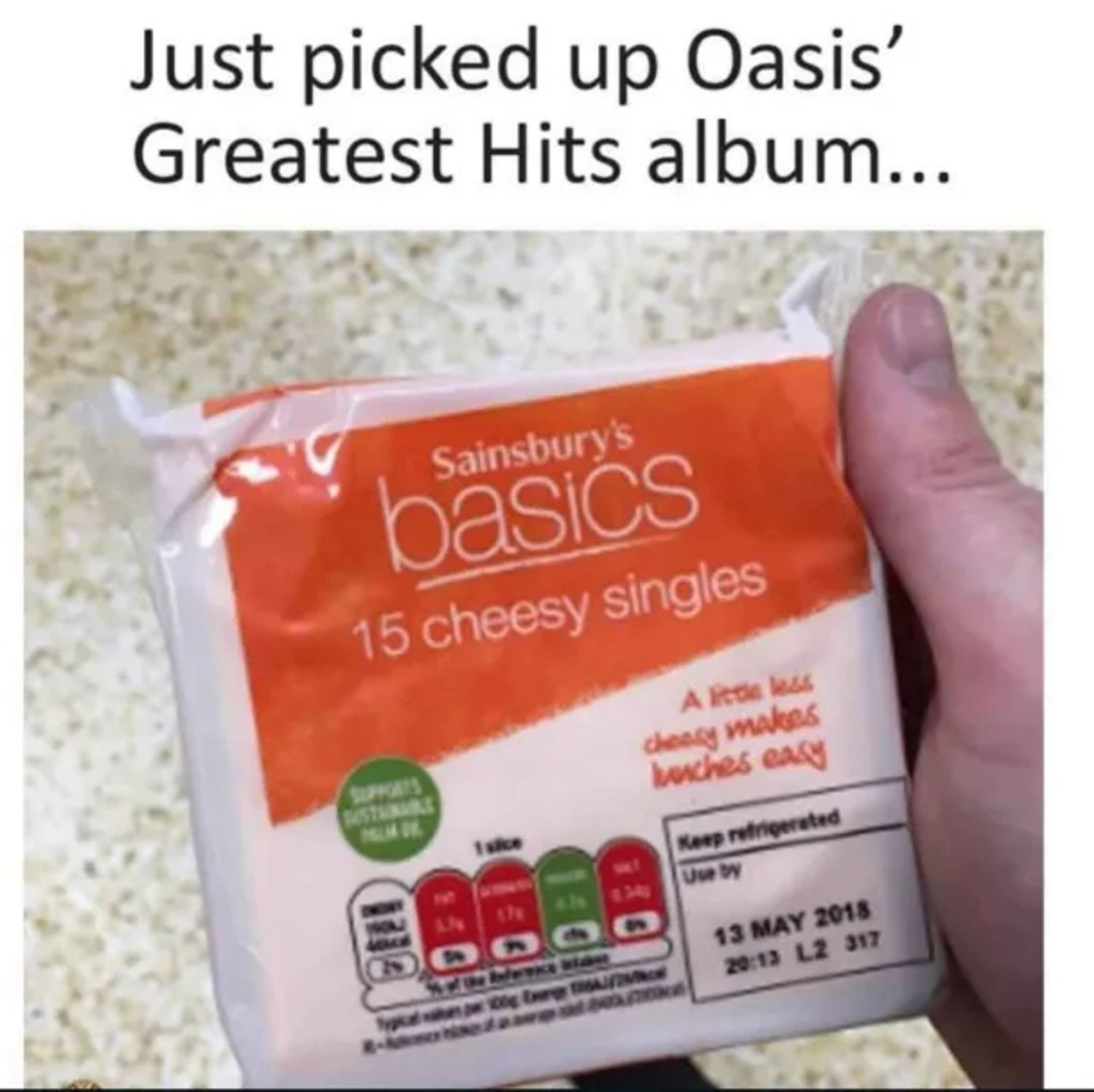 Caption: Just picked up Oasis' Greatest Hits album

Photo: a package of processed cheese labeled "15 cheesy singles"