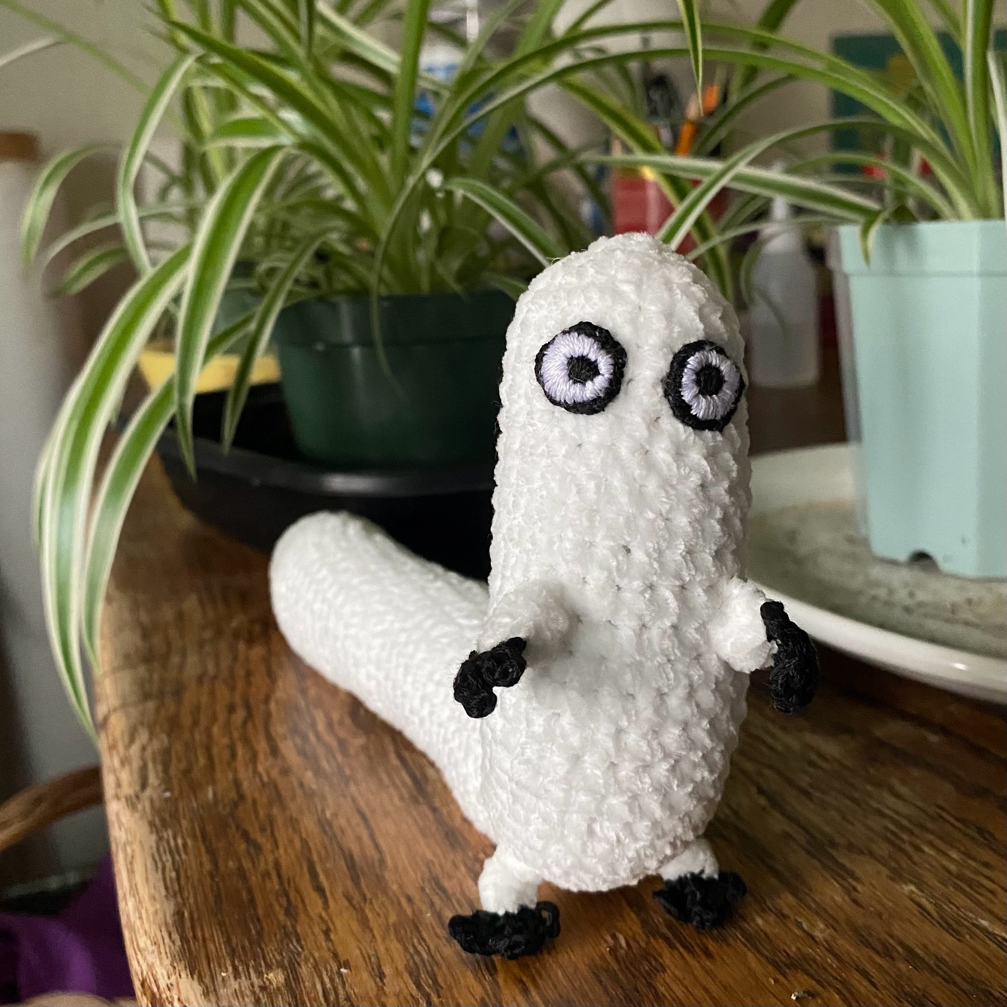 A crochet Brushbuddy from Witch Hat Atelier.