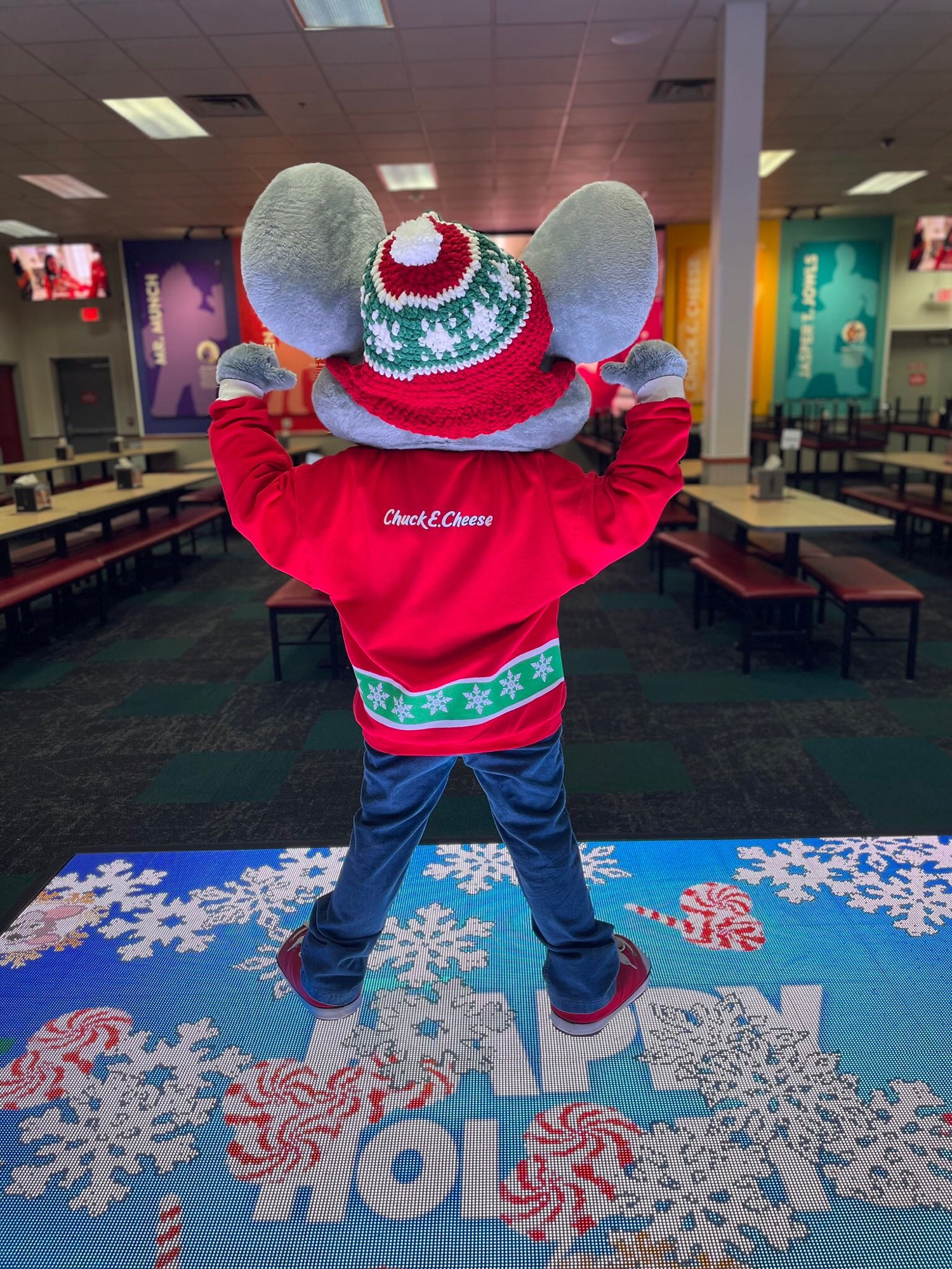 Chuck E. Cheese costume at Chuck E. Cheese the location wearing a fursuit beanie made by YarnRabbit and shirt by shadow_crafts on instagram