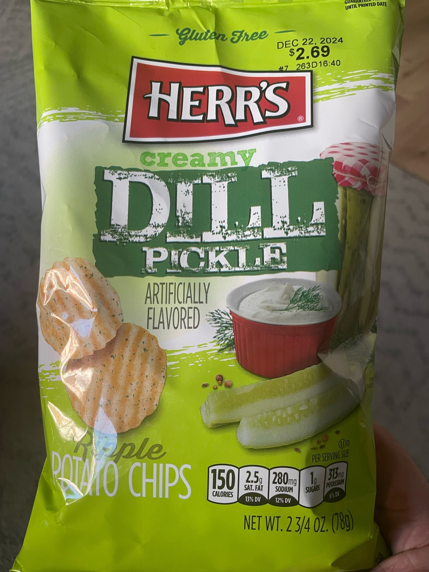 a bag of herr’s “creamy dill pickle” ripple potato chips