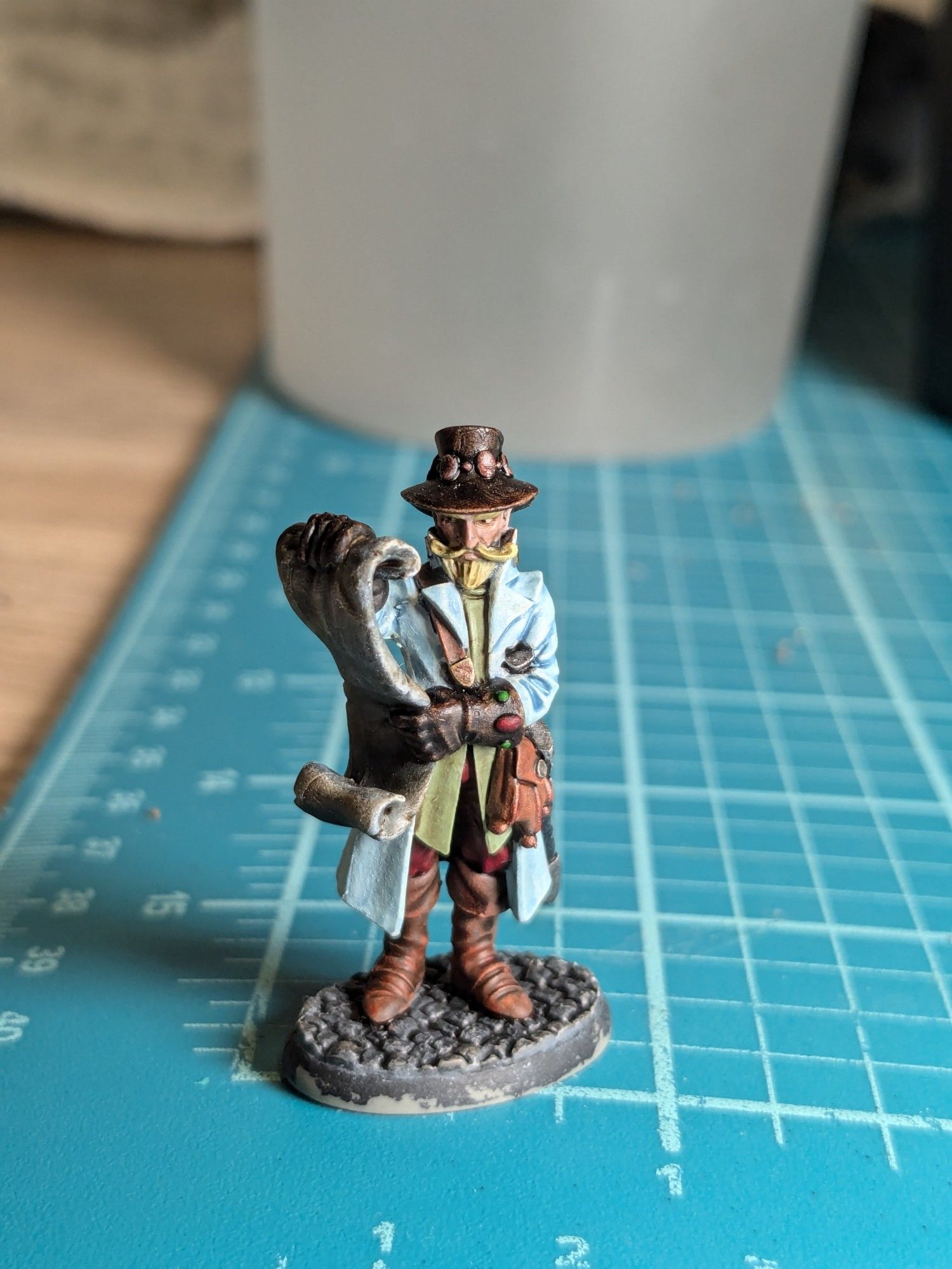 A grumpy looking miniature of a sheriff that has been painted semi-adequately.