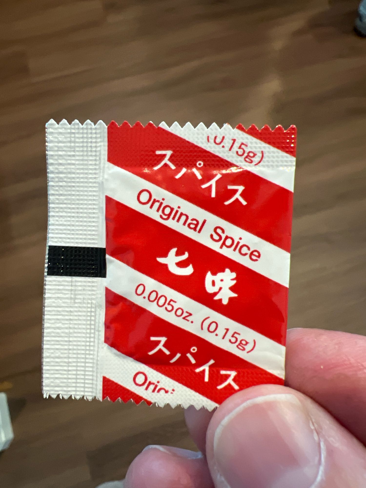 Photo of a small spice packet from an instant ramen package