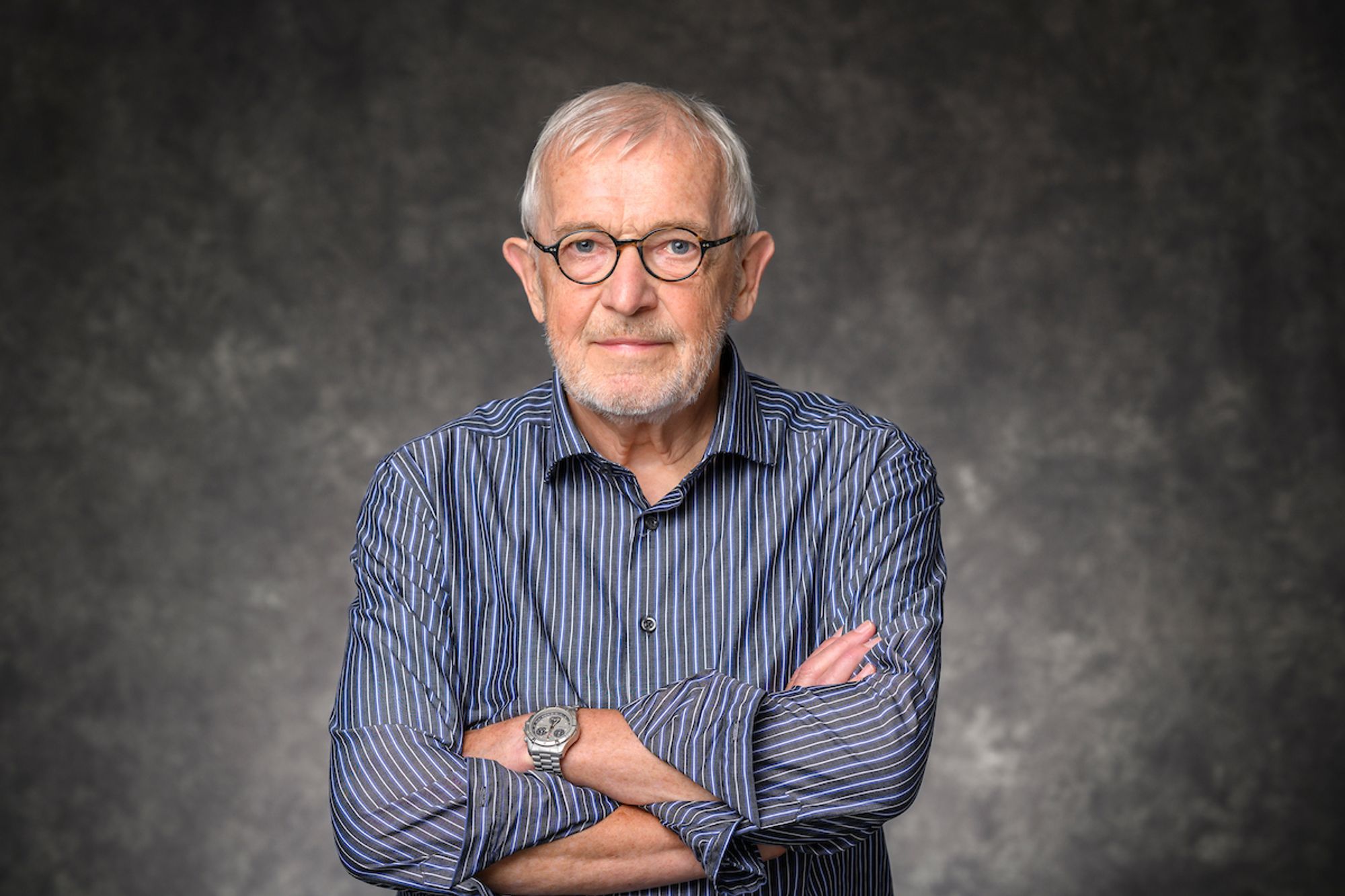 Francis Halzen, principal investigator of IceCube, Vilas Research Professor and Gregory Breit Professor at the University of Wisconsin–Madison, is pictured in a studio portrait on Sept. 18, 2024. (Photo by Althea Dotzour / UW–Madison)