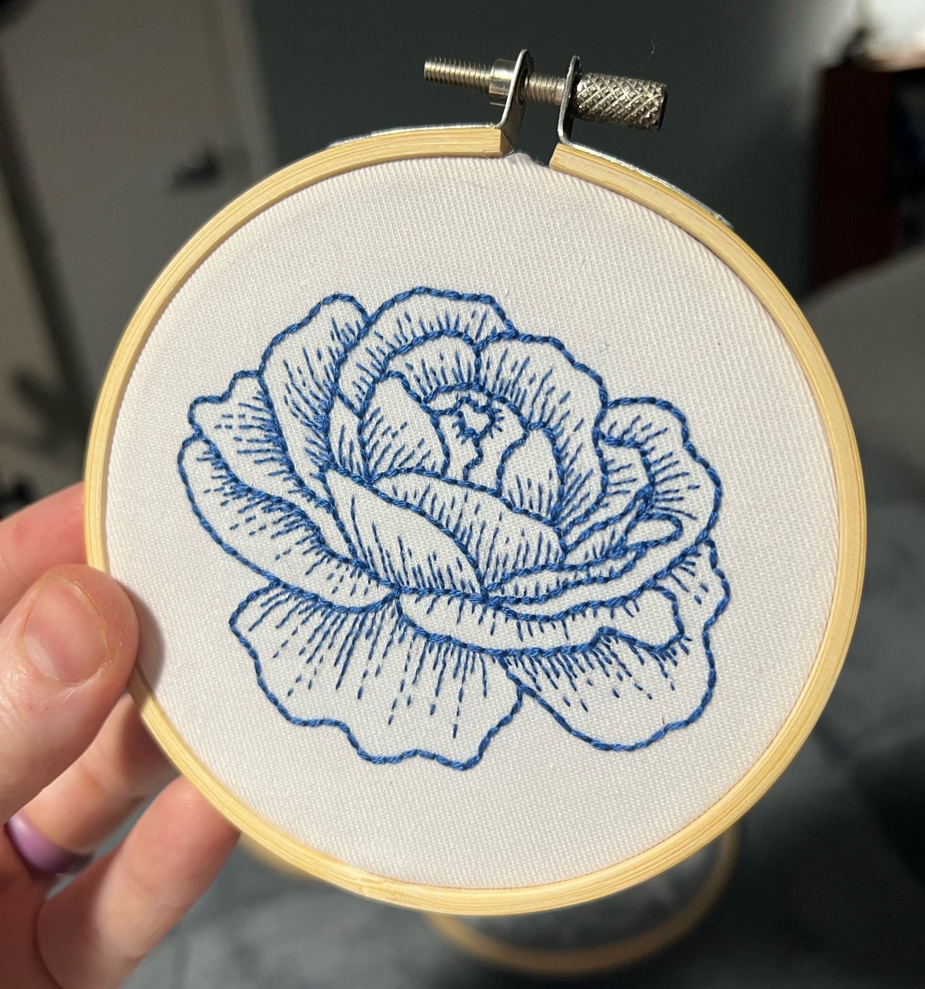 the first embroidery kit I made, back in 2001, while in a hospital waiting room. it’s a little 4” blue rose designed by Tamar Nahir-Yanai at https://www.tamarny.com/