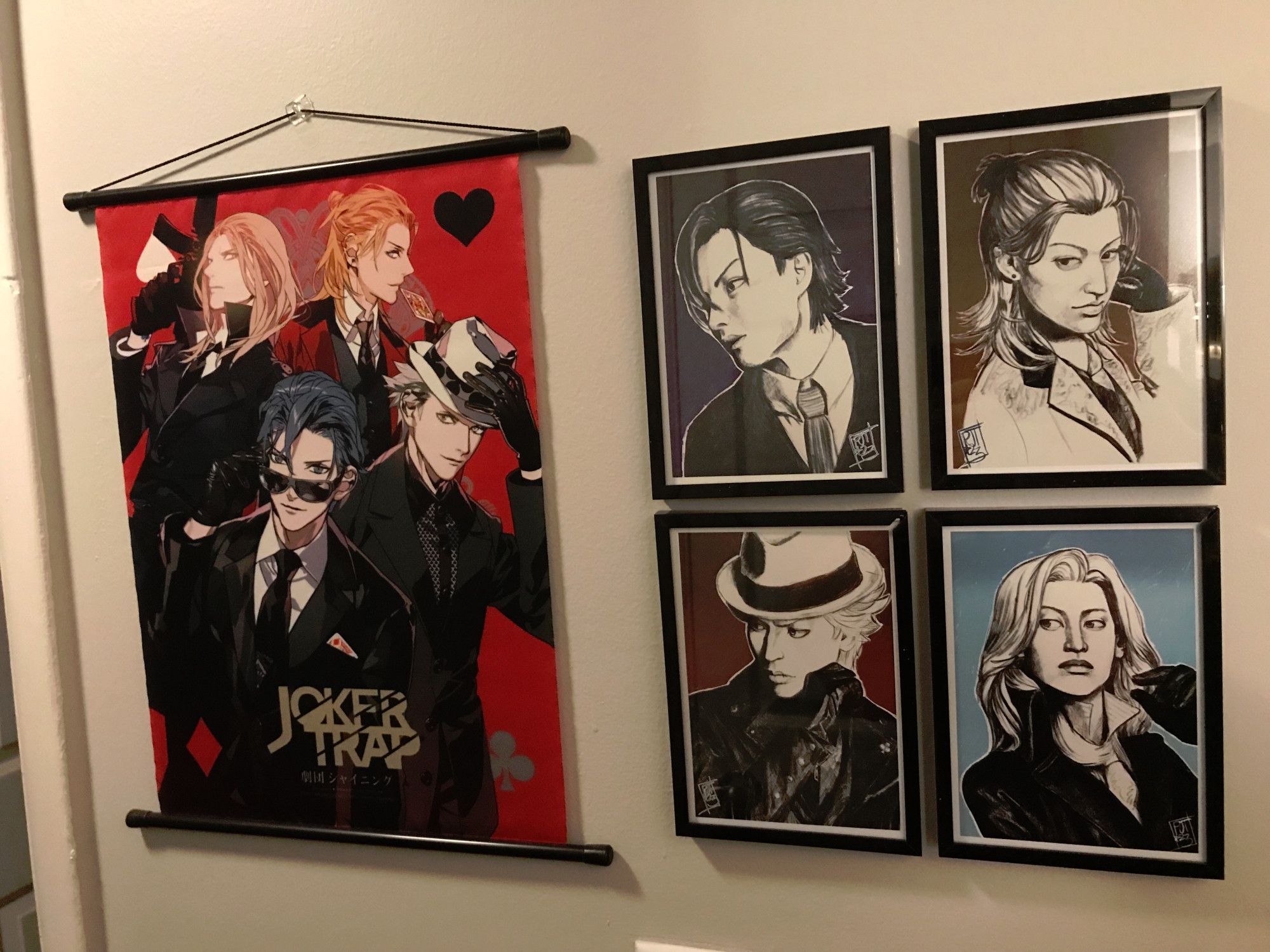 The Joker Trap set, framed on the wall along with a Joker Trap tapestry featuring the original character art from the drama CD.