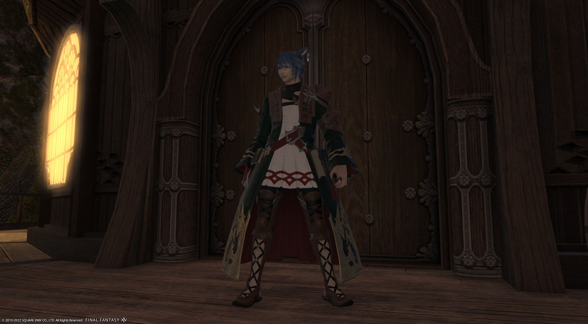 A screenshot from FFXIV of Aoba as a Miqo'te summoner at level 50 in the artifact gear, outside a wooden building in Gridania.