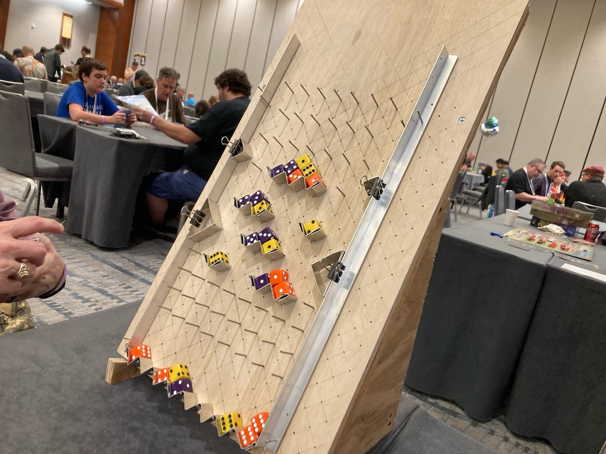 65° angled pachinko-styled board with dice on it.