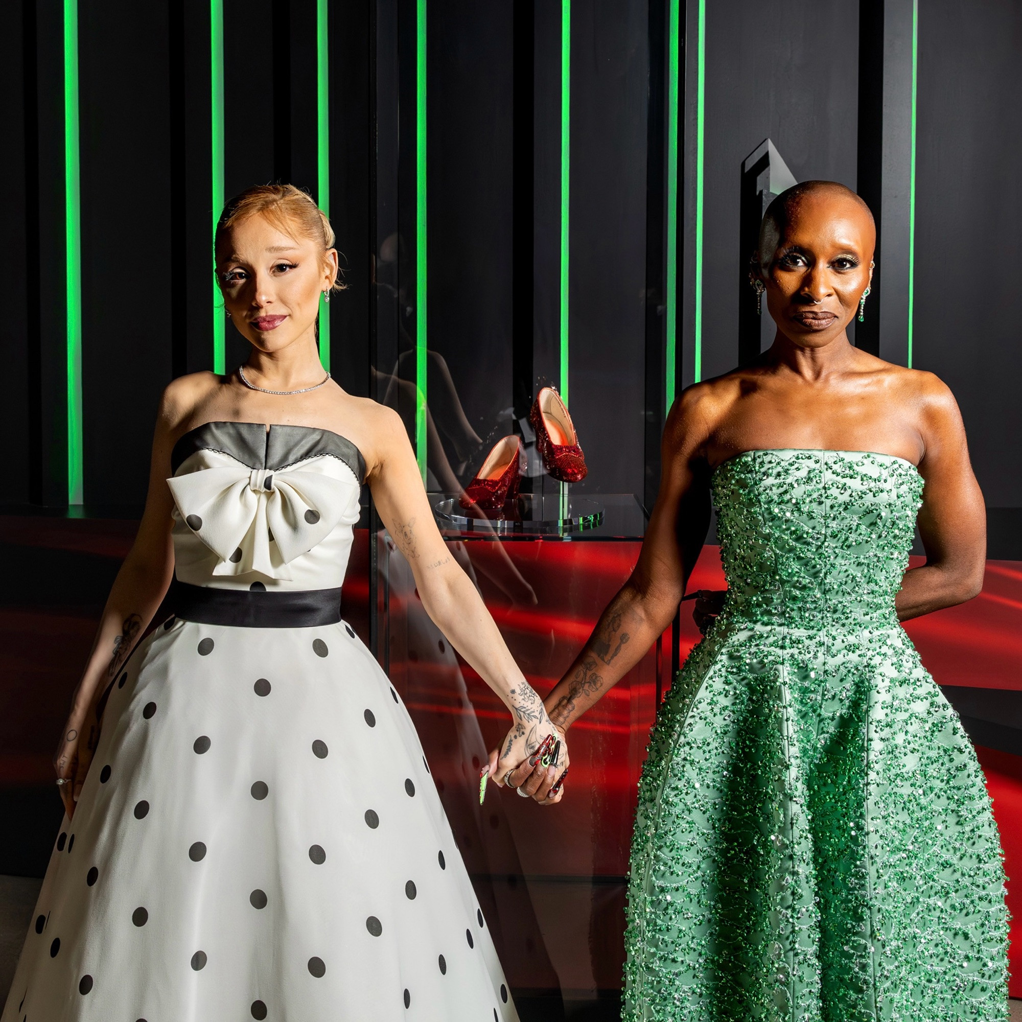 Ariana Grande and Cynthia Erivo with Dorothy’s ruby slippers from “The Wizard of Oz”