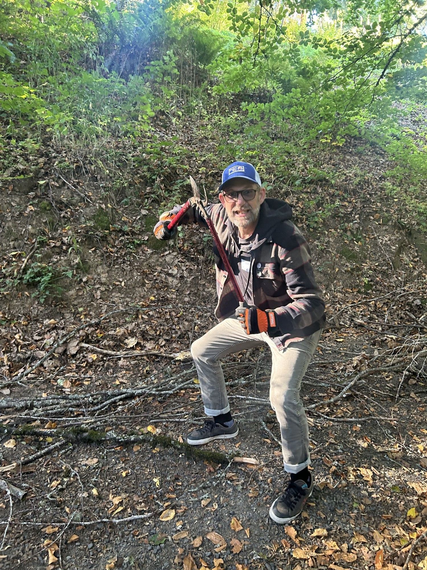 Me, standing aggressively with tree loppers in my hand while in the woods at Hoyt Arboretum.