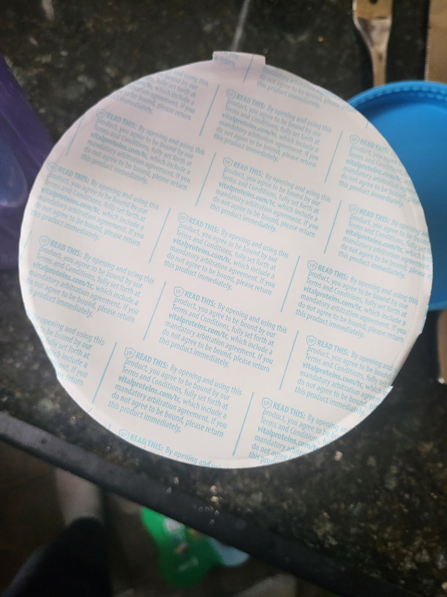 A protein powder label explaining that by opening the seal you are bound by T&C including mandatory arbitration.