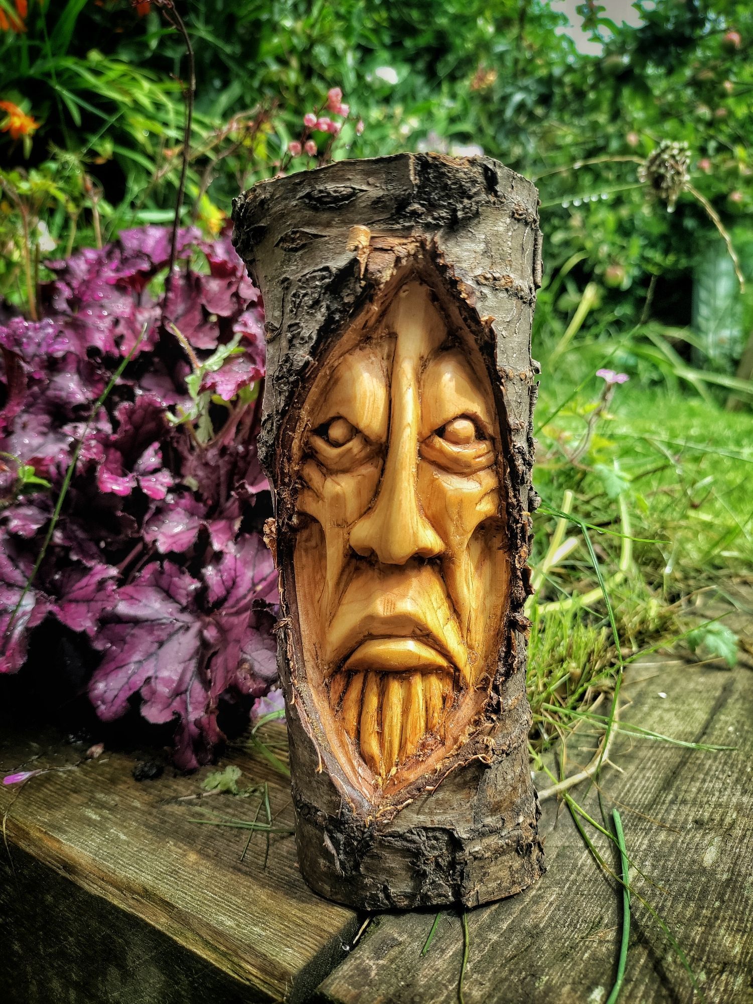 Cherry wood spirit, looking pissed off about being photographed in a nice garden in the sunshine 