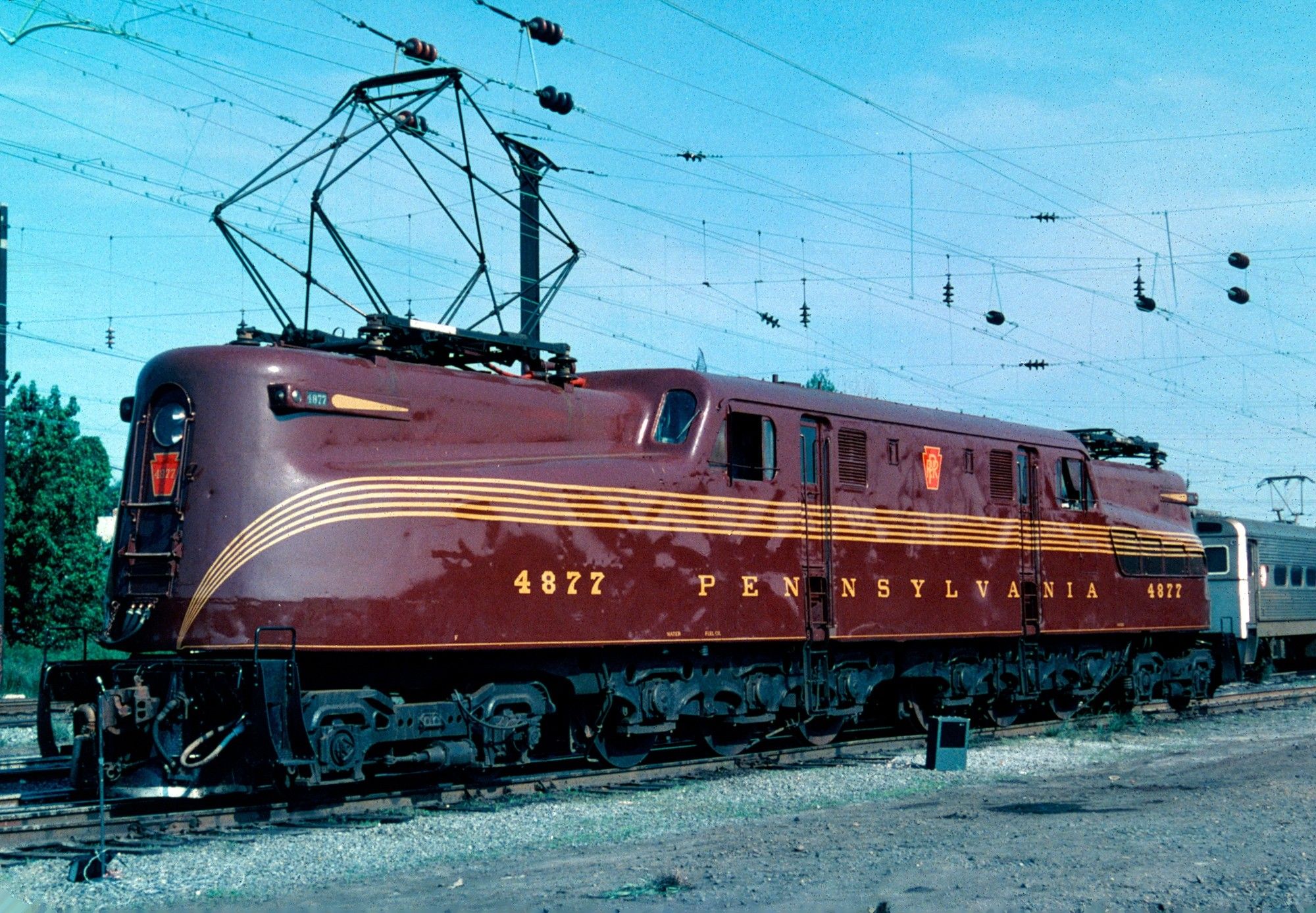 GG1 painted Tuscan Red on a siding track