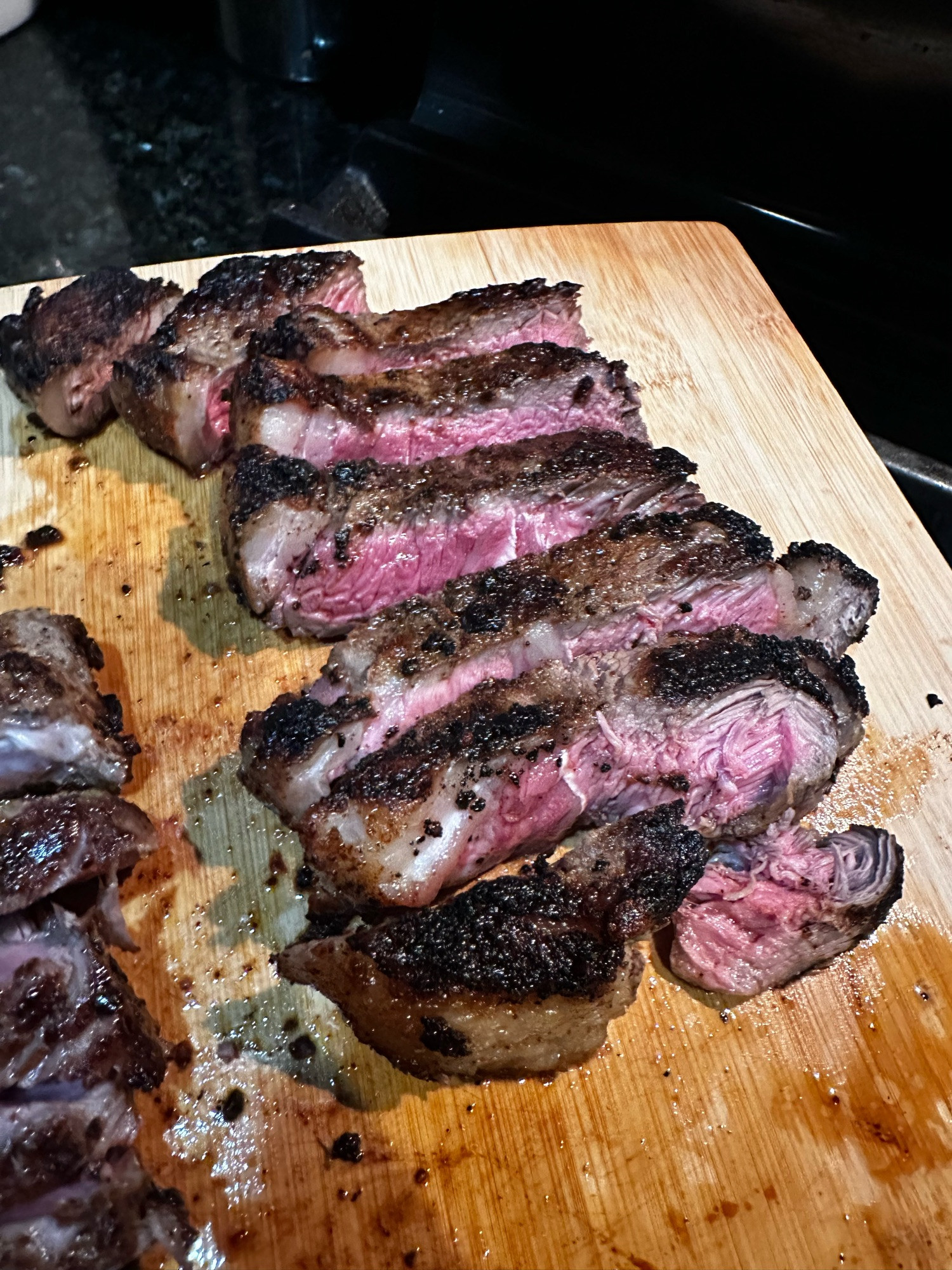 steak on a wooden cutting board