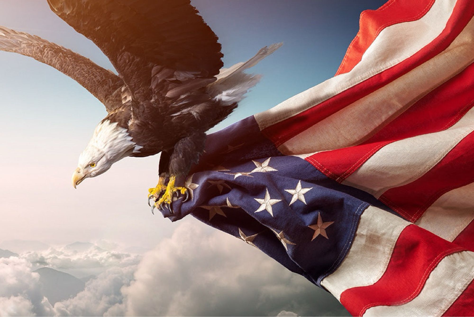 An eagle flying above the clouds carrying a US flag in its talons