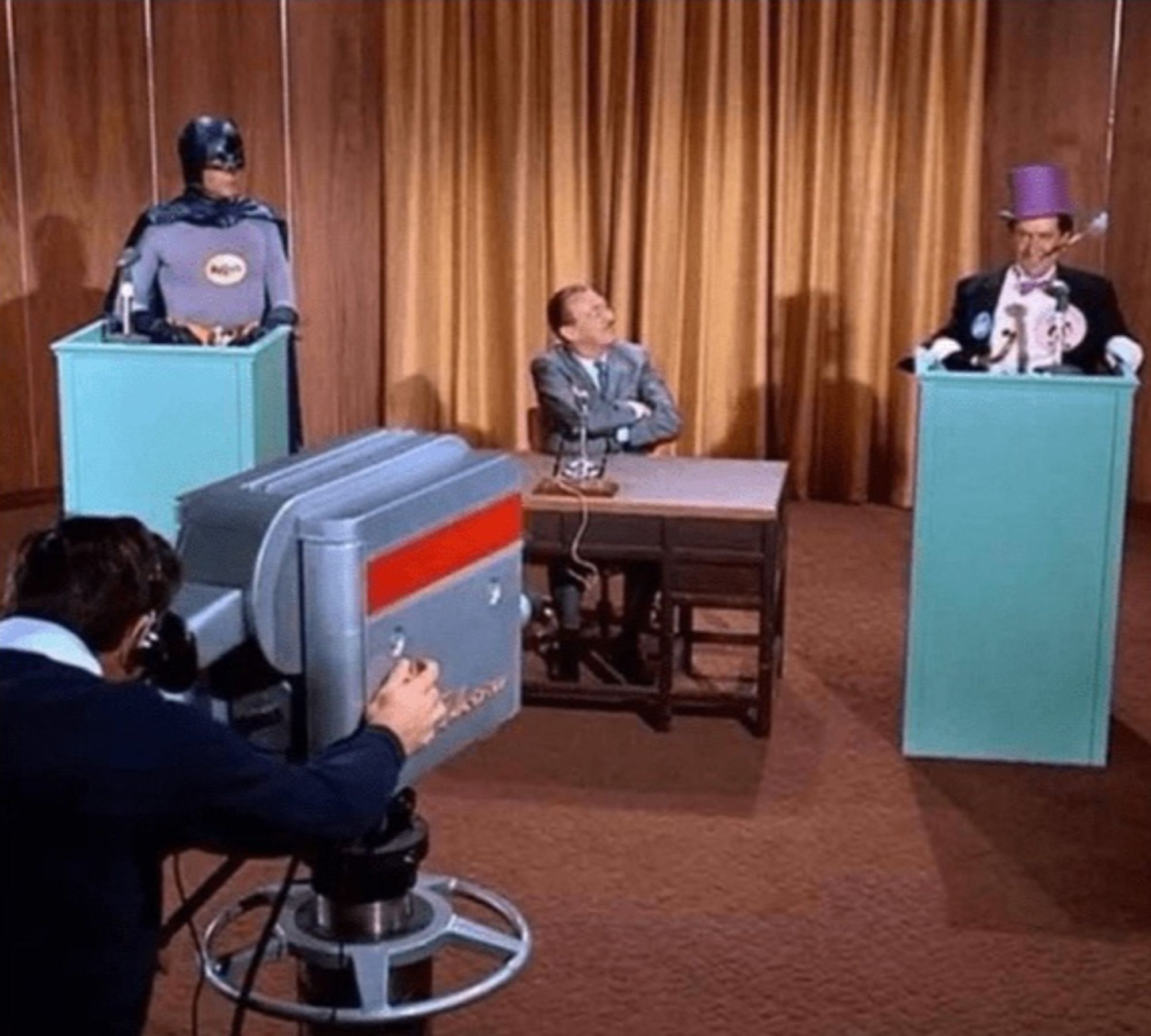 Batman (1966) Penguin and Batman having a TV debate