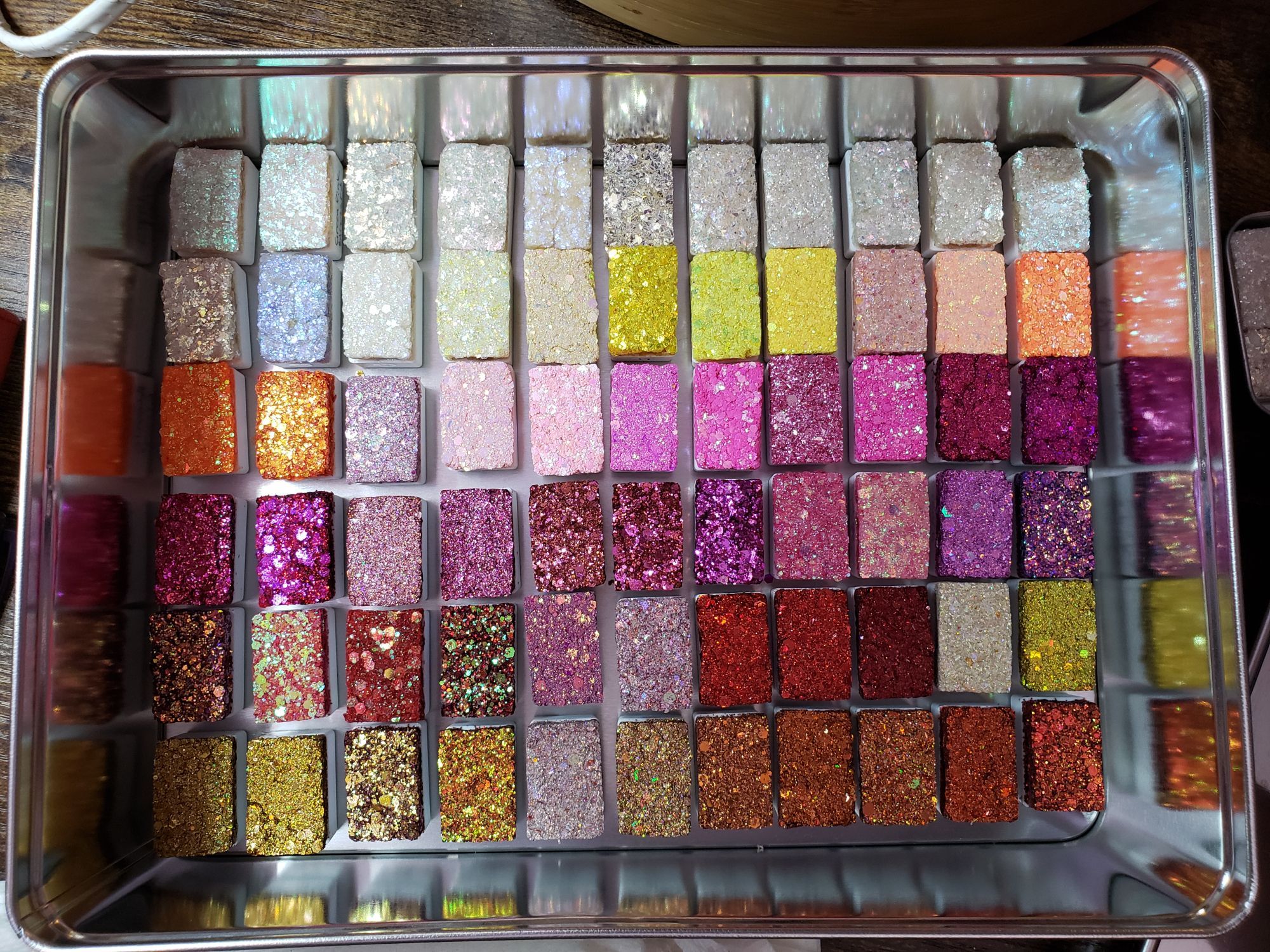 glitter paint in large blocks of pinks, reds, golds