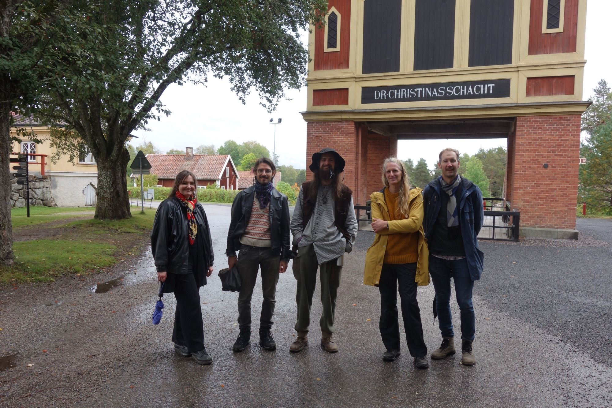 people standing in front of the Christina Shaft in Sala, Sweden