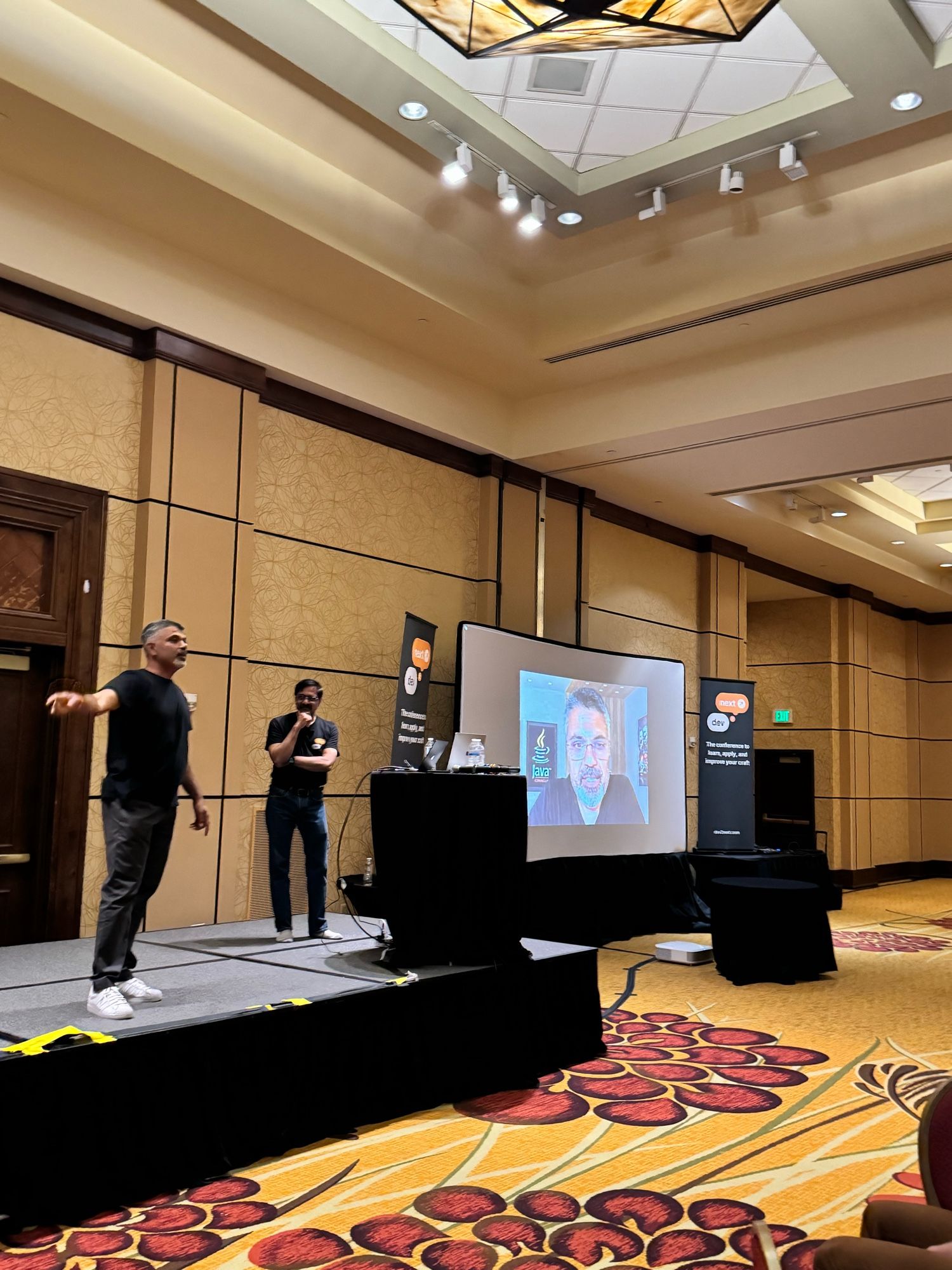 Sharat and Venkat on stage. Sharat’s photo is on the screen