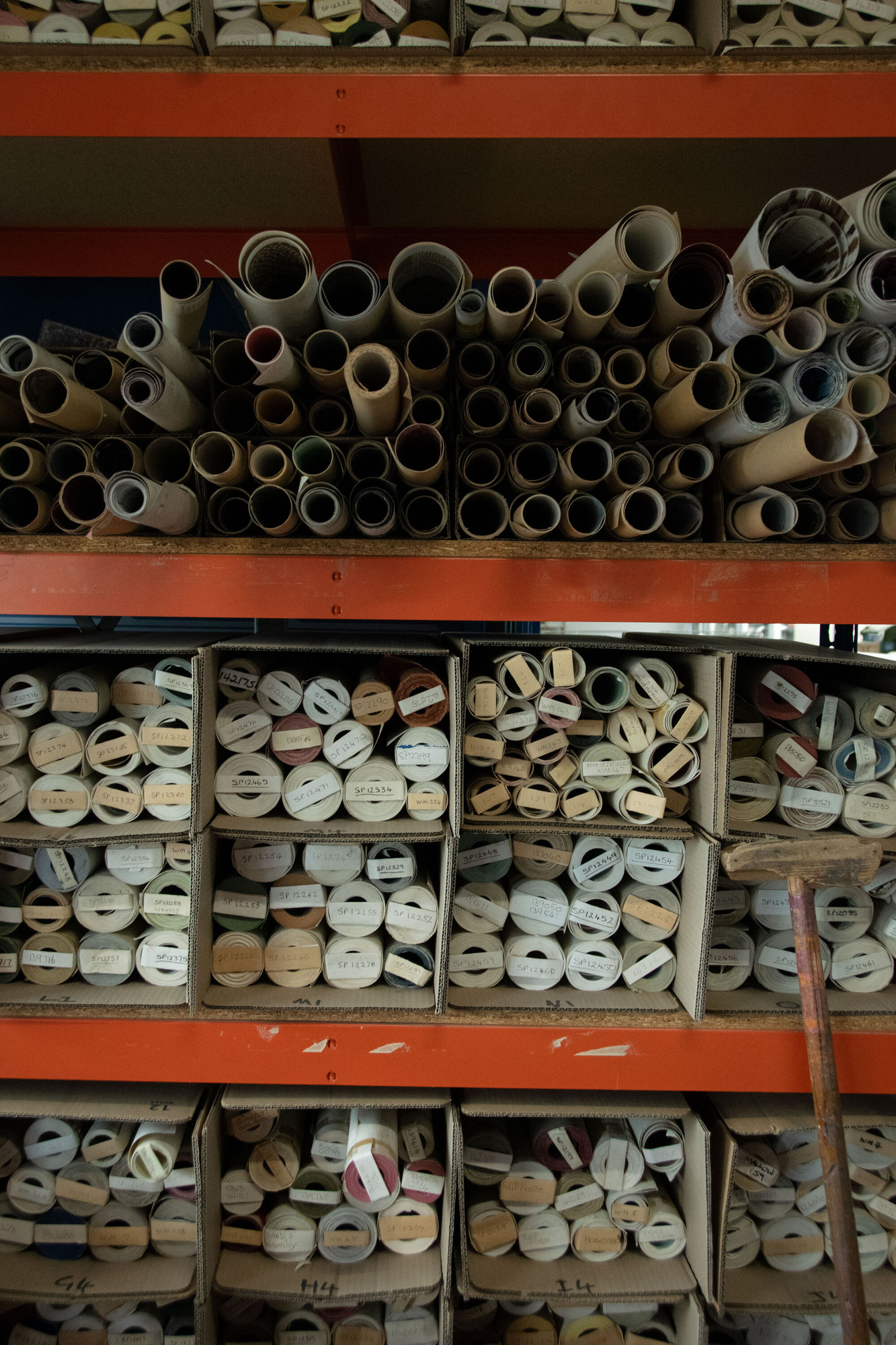 Tubes stored on shelving.