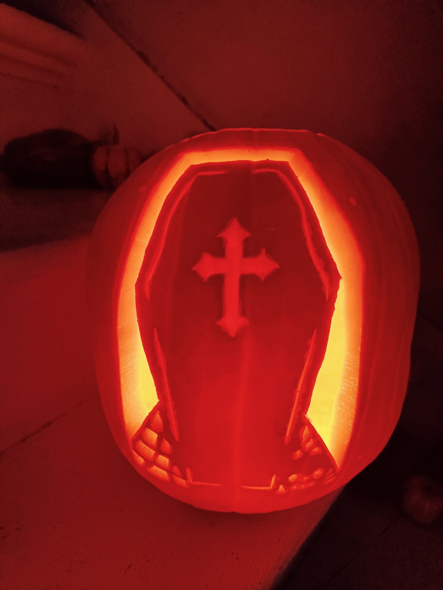 Carved pumpkin with coffin