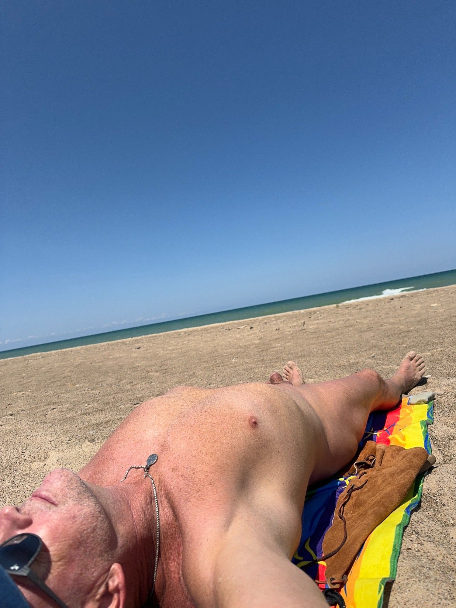 Nude male on Lake Michigan public beach