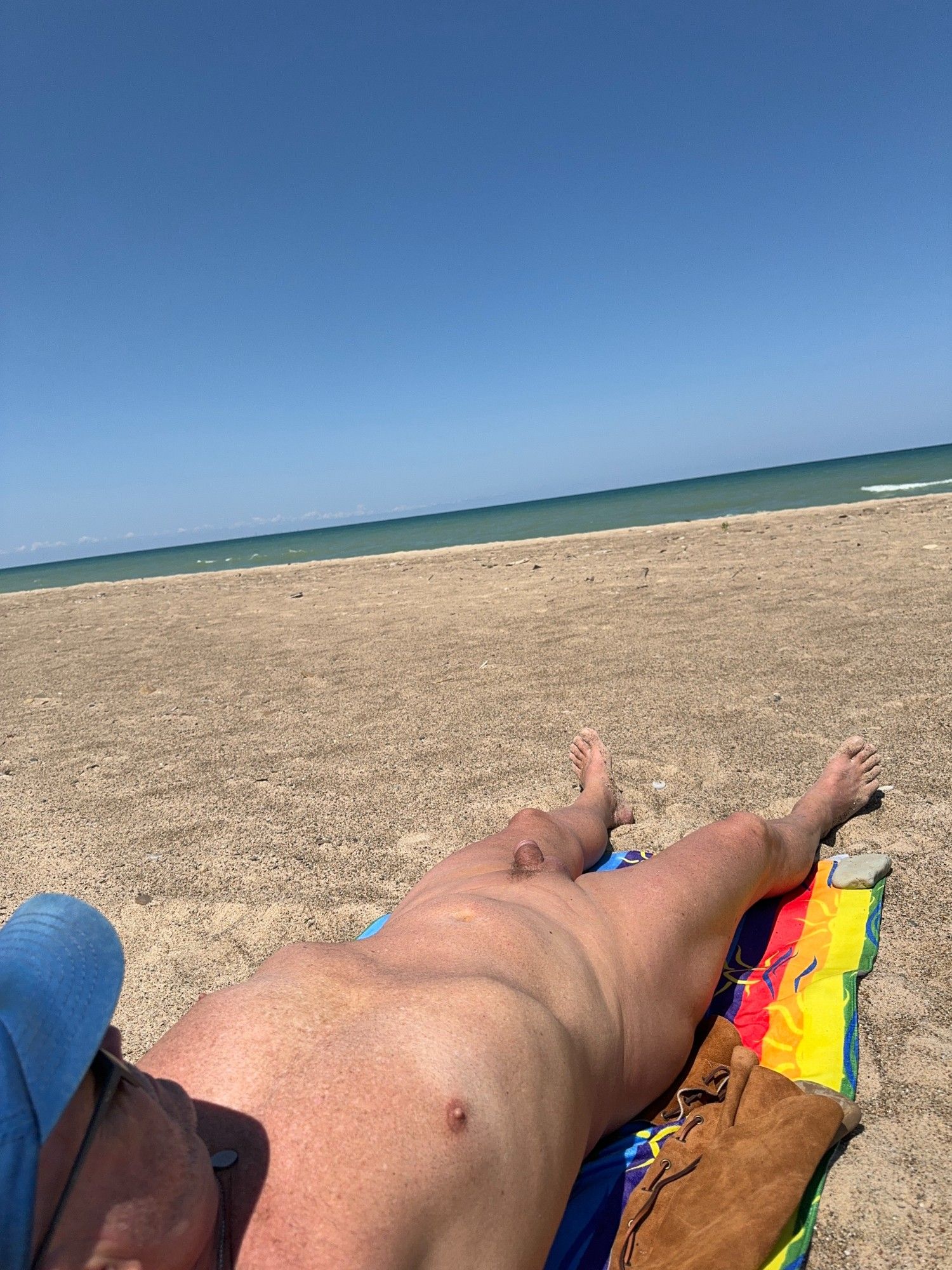 Nude male on Lake Michigan public beach