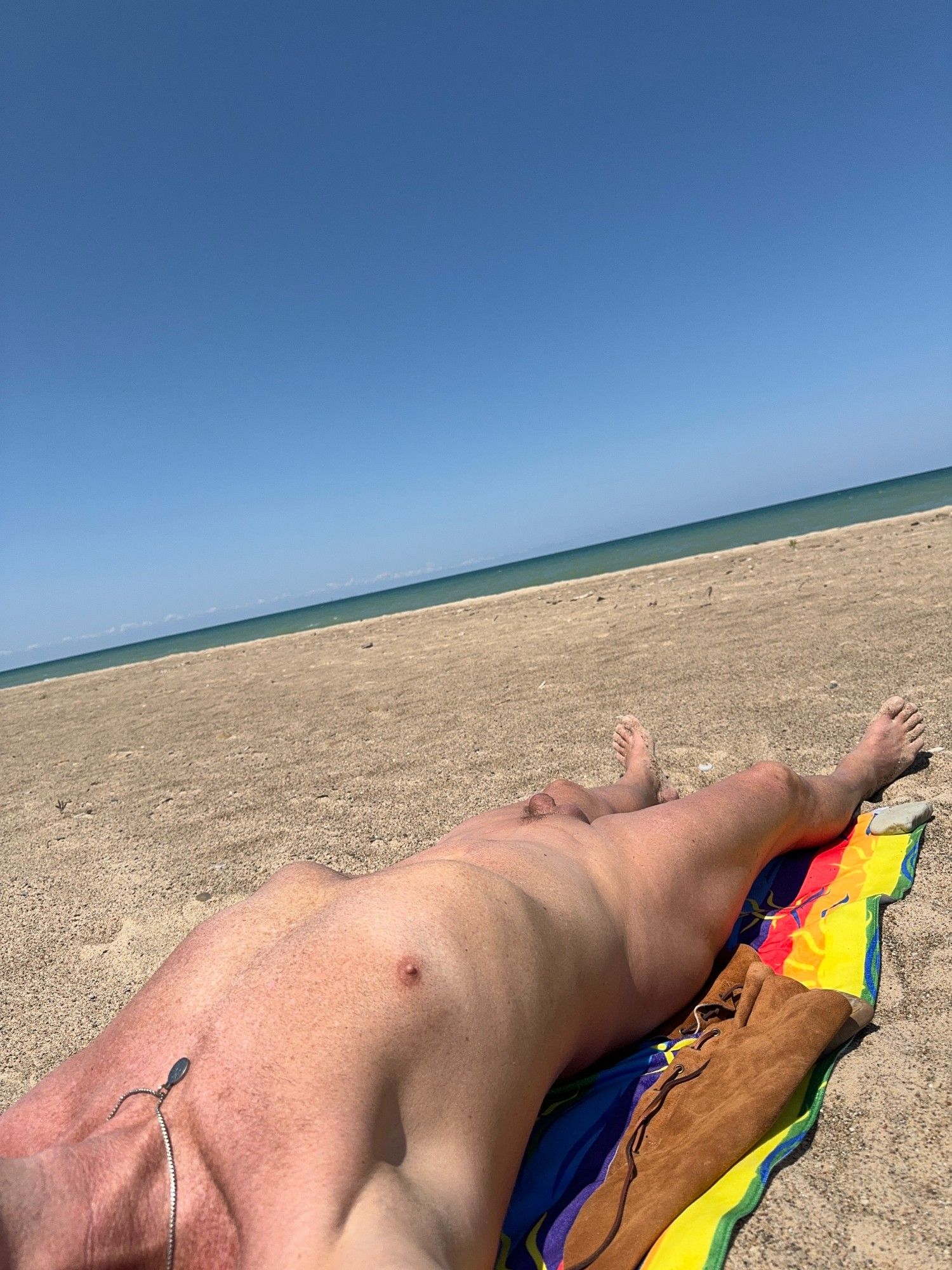 Nude male on Lake Michigan public beach