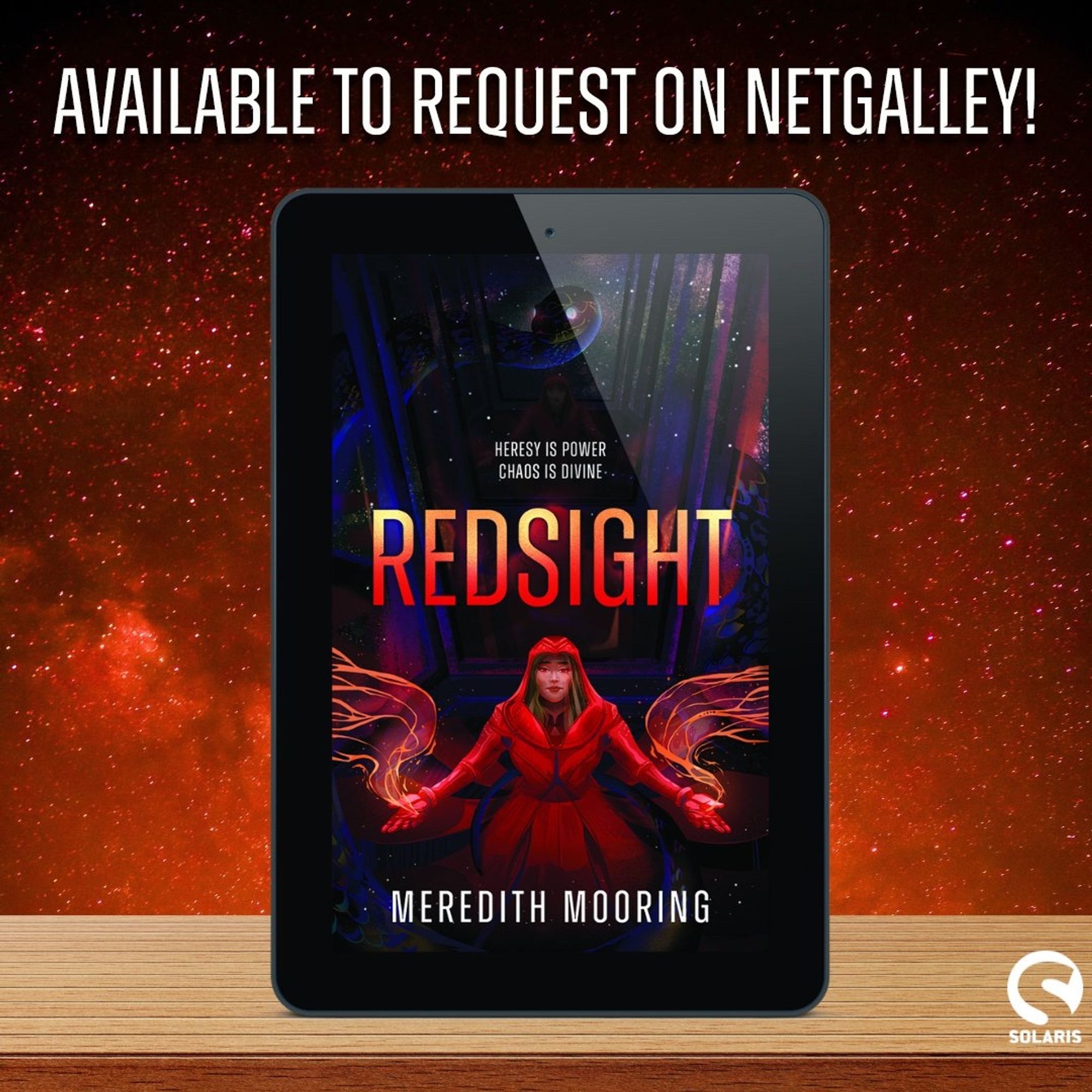 A galaxy background with an iPad on a table. The cover of Redsight is on the iPad screen. The cover shows a woman in red clothing standing in a mirrored room with a galaxy design on the glass. There’s a snake looking down at her and energy/magic coming from her hands. The title font is multicolored and it says REDSIGHT in all caps. the author name Meredith Mooring is at the bottom.