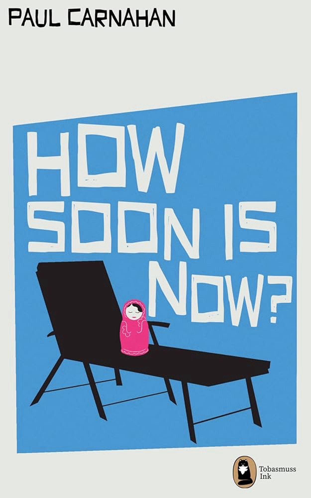 The cover of How Soon Is Now, a novel by Paul Carnahan. A pink matryoshka doll sits on a black sun-lounger type chair. The main background is blue, the colours are flat and the graphics highly stylised