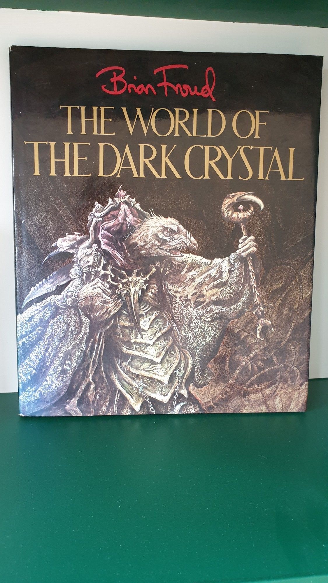 Cover of The World of the Dark Crystal, an art book by Brian Froud of the film by Jim Henson. Depicts a Skeksis holding a sceptre