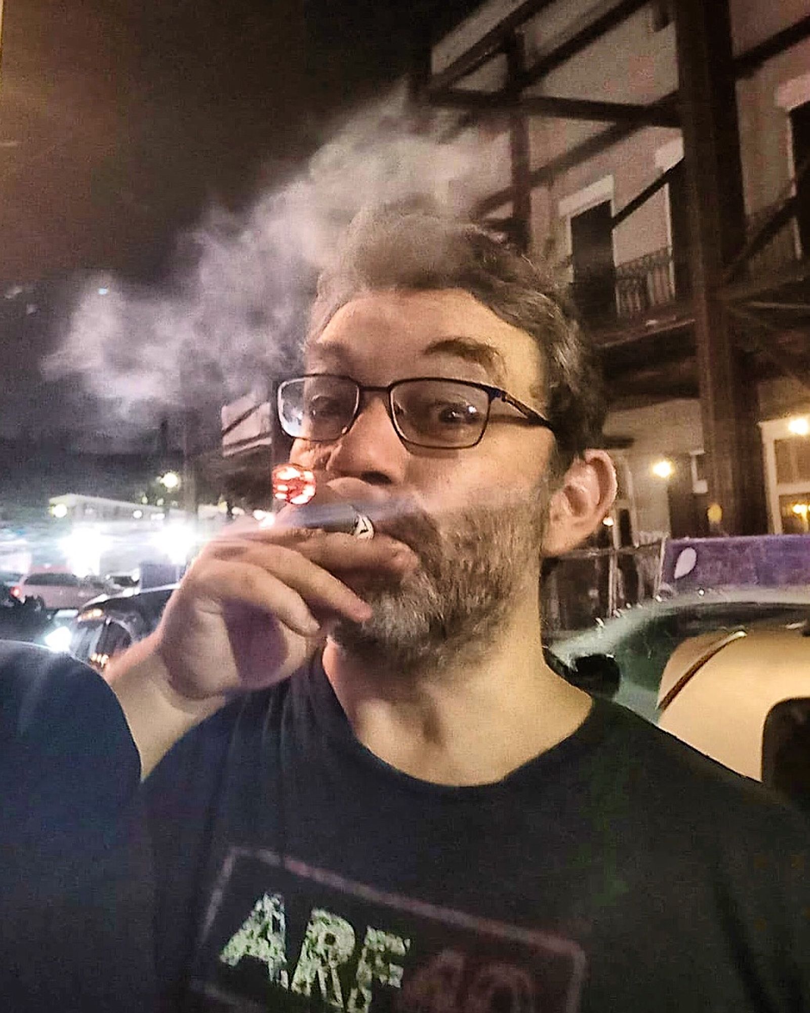 Director Randy Mack smoking a cigar on Frenchmen Street