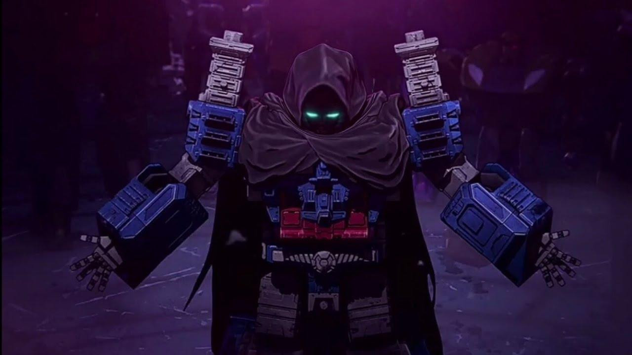 Screenshot from "Transformers: War for Cybertron" on Netflix showing Ultra Magnus wearing a dark cloak covering his face and upper chest. His eyes glow green underneath the hood and his arms are spread slightly showing he is unarmed.