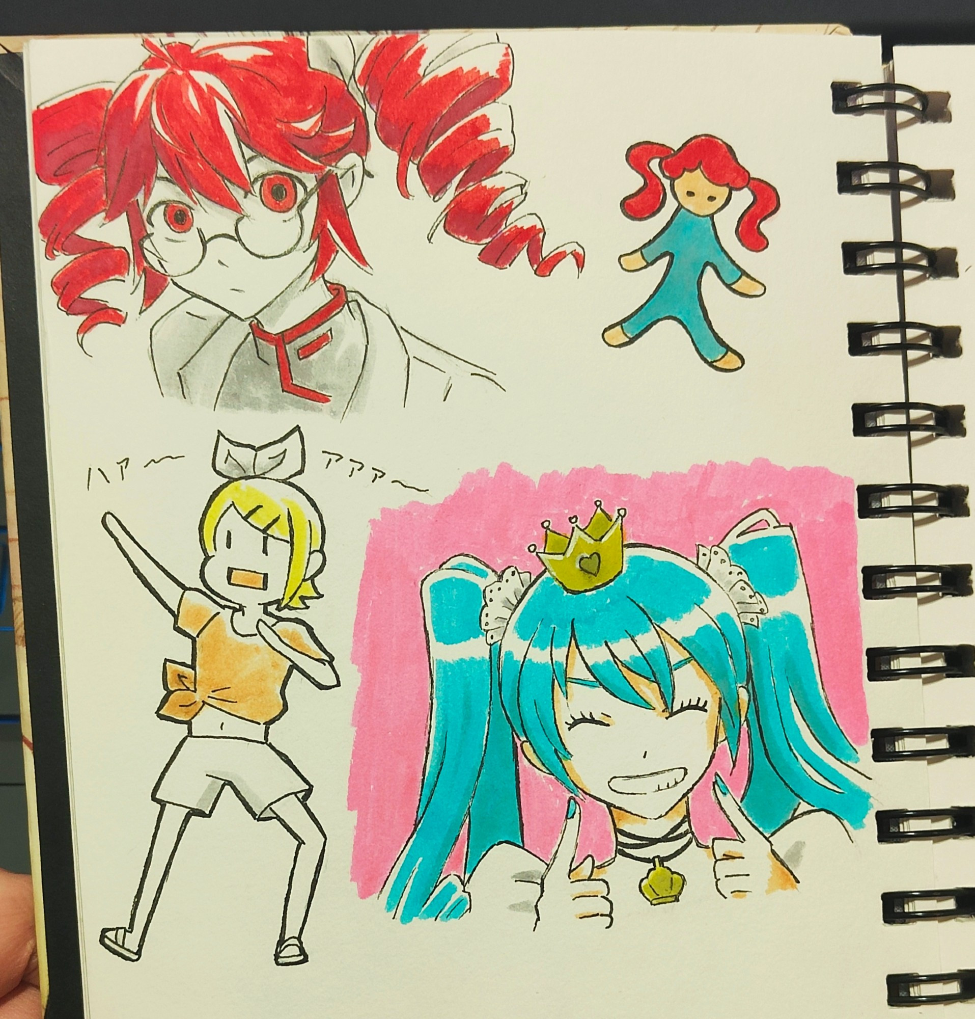 A sketchbook page full of Vocaloid characters.

At the upper side are 2 drawings of Kasane Teto as she appears at 'Igaku' videos.

Lower left coner is Kagamine Rin in one of her poses from the Teterettey video.

At the lower right corner is Hatsune Miku and her mischievous smile from the World Is Mine video. 