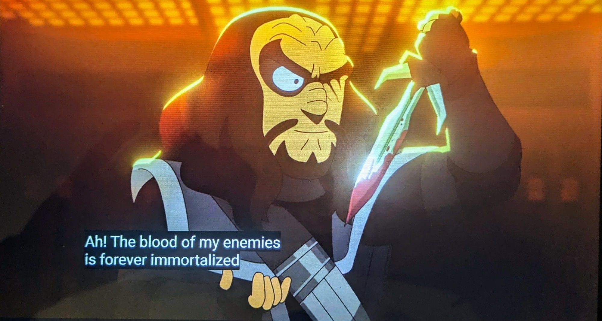 Martok is shown in his starring role in Bat'leths & BiHnuchs, his left eye wounded shut and his blade dripping with blood. The caption reads, 'Ah! The blood of my enemies is forever immortalized'