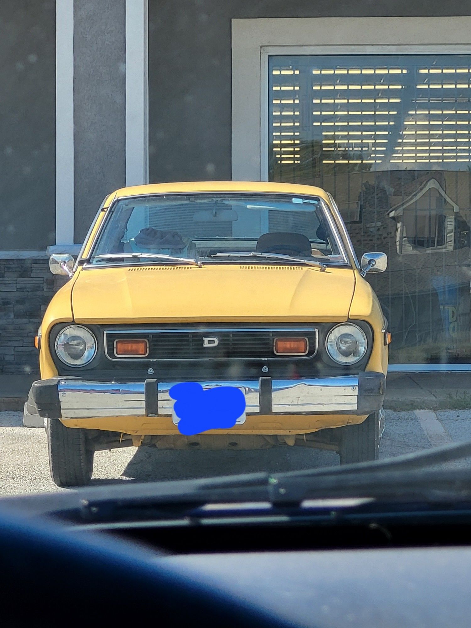 Front shot of the same yellow Datsun