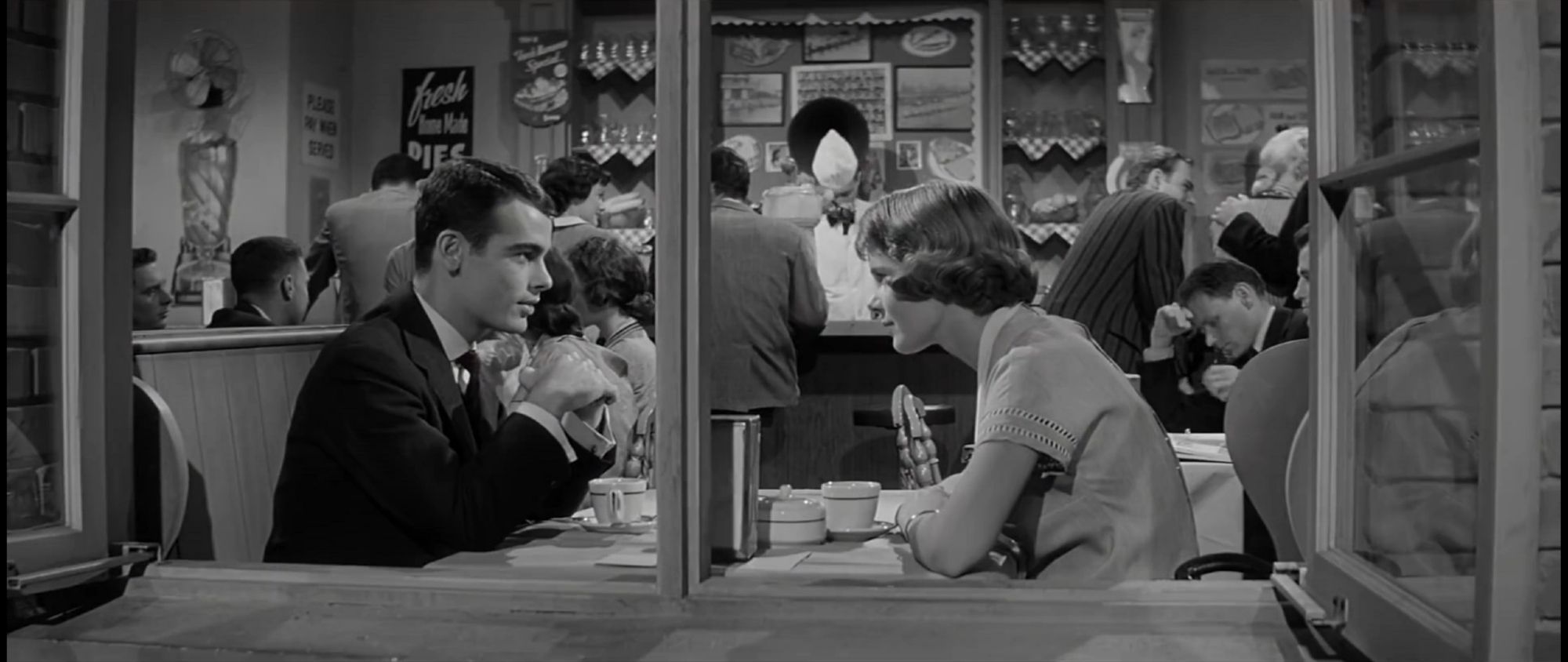 Judd Steiner (Left) and Ruth Evans (Right) hanging out at a diner.