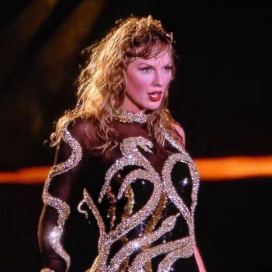 Taylor Swift wearing the new black and gold Reputation outfit. 