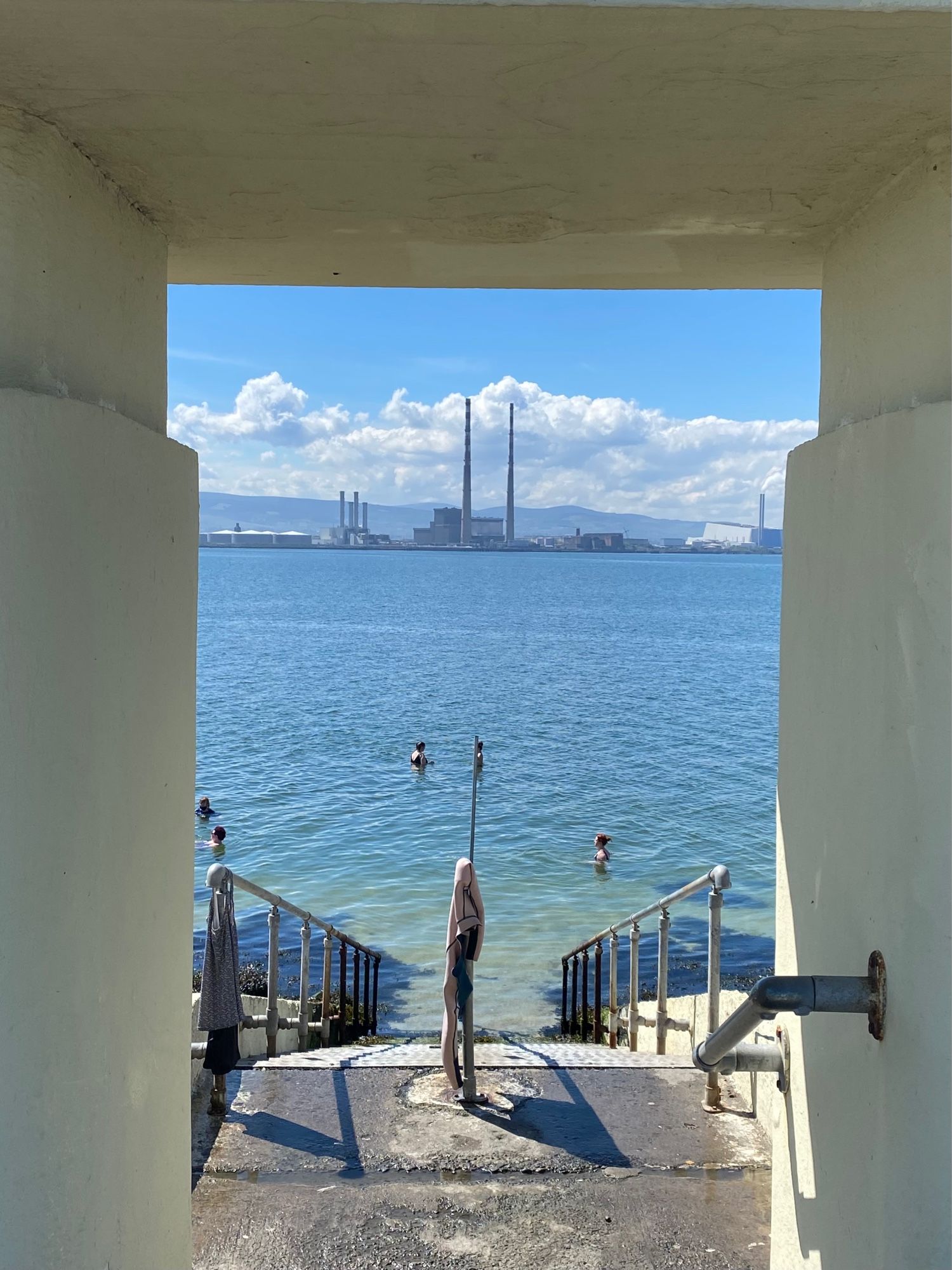 Poolbeg chimneys from bathing shelter on Bull Island