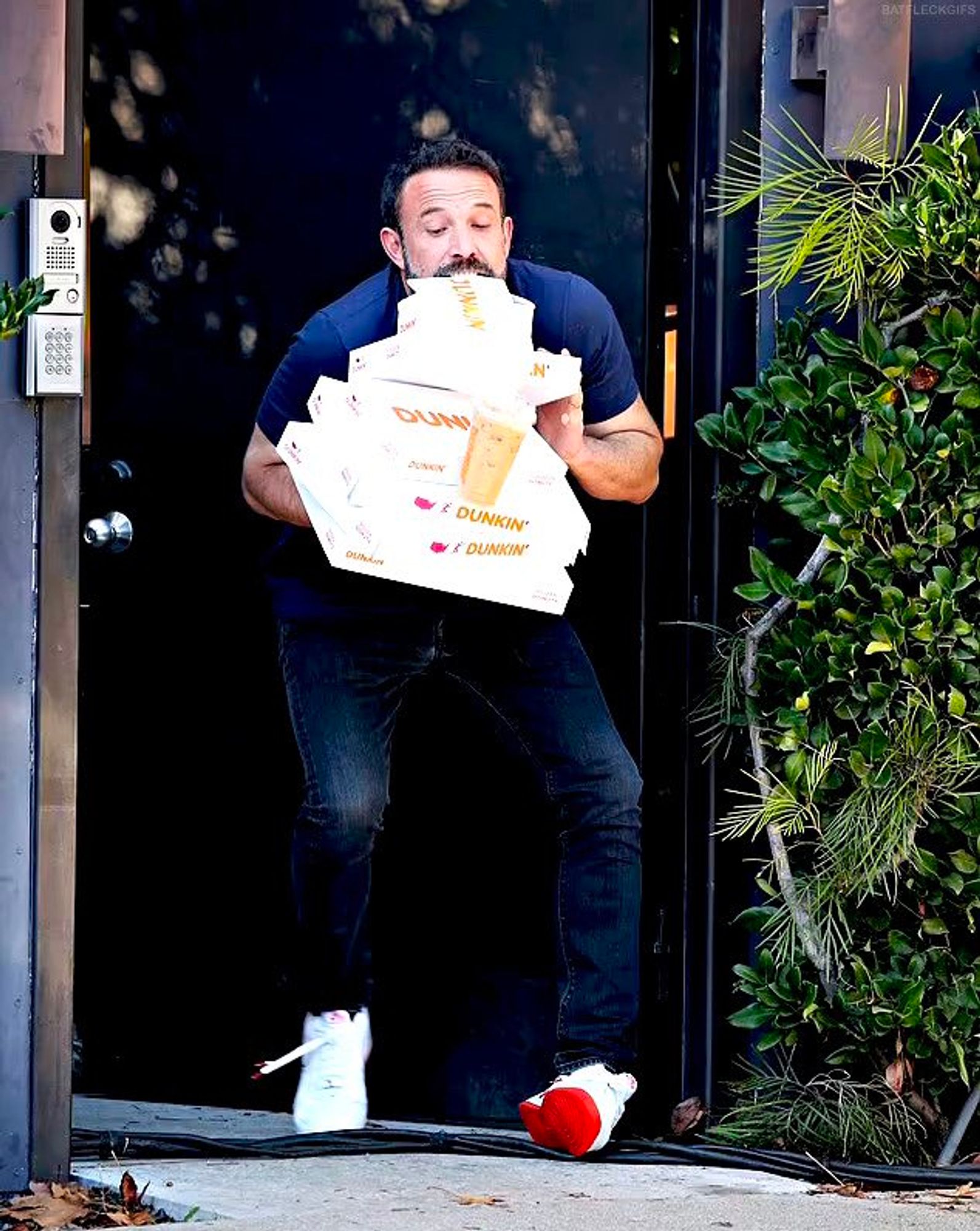 ben has made the decision to place the iced coffee on the boxes — a precarious choice. now all he has to do is back into his apartment door without spilling the coffee. what could go wrong.