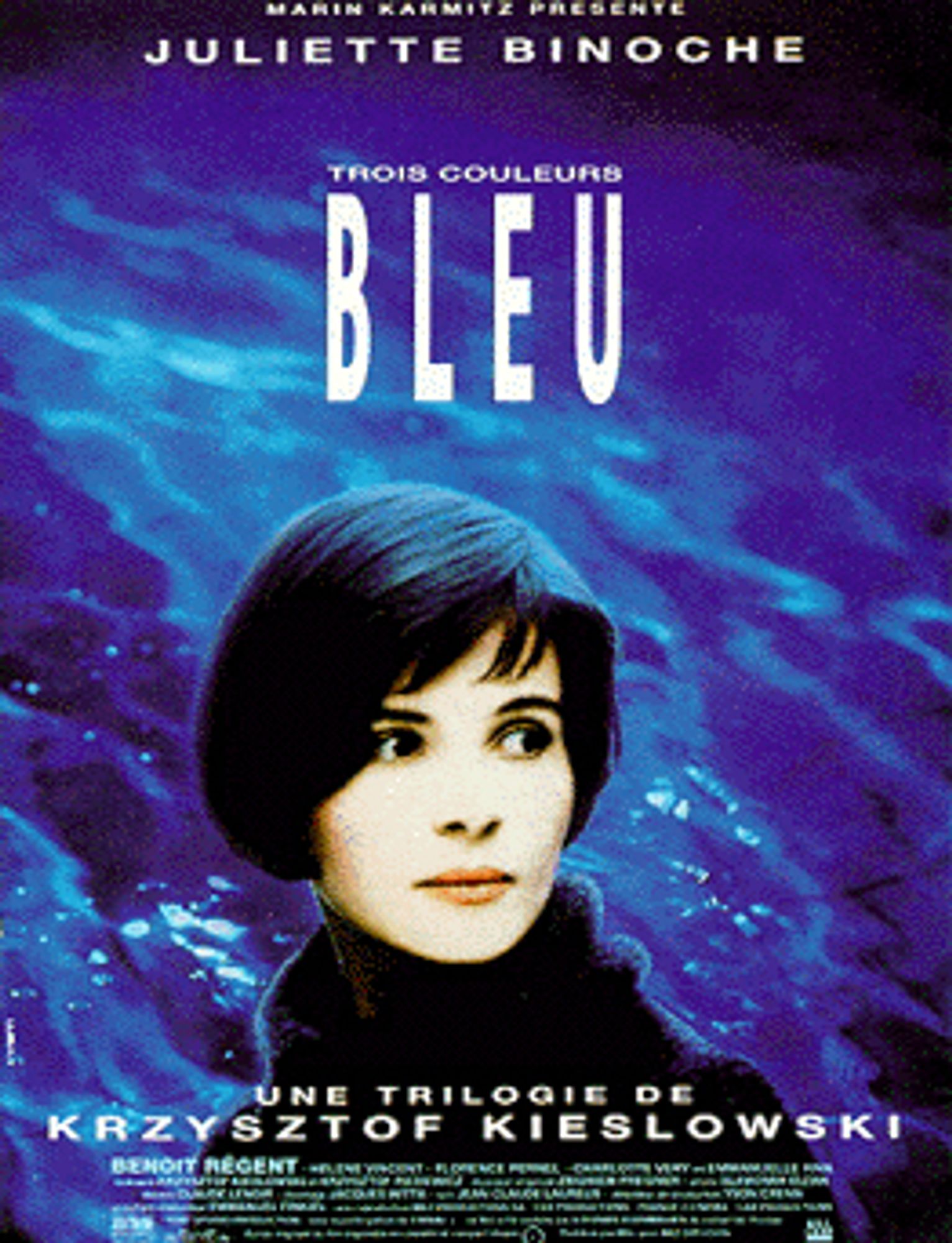 A blue poster for Krzysztof Kieślowski's Trois Couleurs: Bleu. The cover has a young Juliette Binoche with the background of a swimming pool.