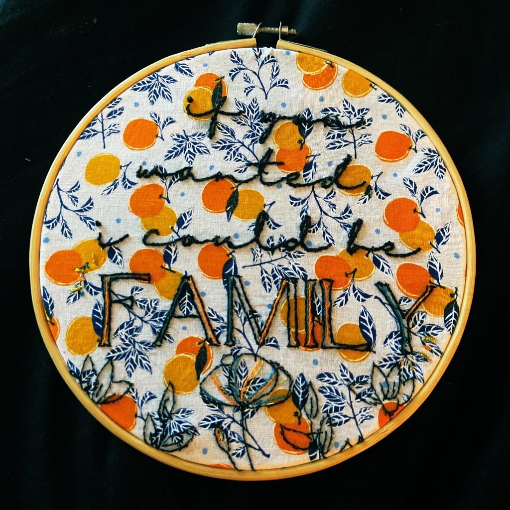 if you wanted i could be family embroidered onto a fabric with oranges