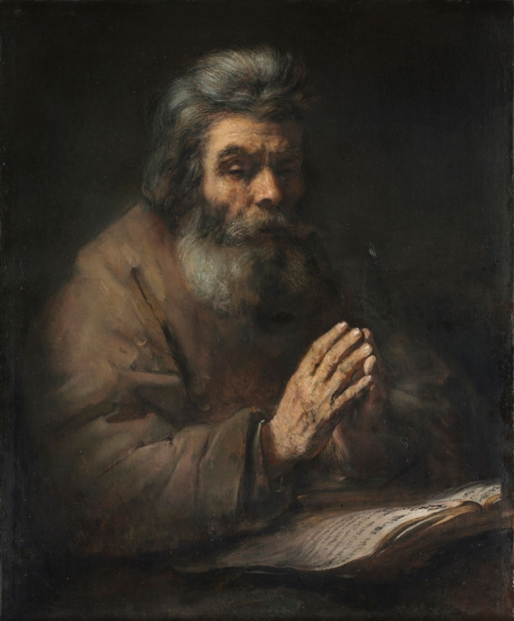 Toward the end of his life, Rembrandt explored religious themes from an intimate perspective, producing a number of works for a possible Apostle series. The personal religiosity of <em>An Elderly Man in Prayer</em>, formerly attributed to Rembrandt, bears resemblance to such late works. Seated with eyes nearly closed and hands clasped in prayer over a large book, the figure appears still and introspective. While the dramatic lighting and dark color palette are reminiscent of Rembrandt's late works, this painting, formerly attributed to the artist, has since been assigned to a follower or a later eighteenth-century imitator of Rembrandt's style for reasons associated with the broad, flat brushwork of the garment, the poor handling of shadow on the hands, and the uniform treatment of the hair.