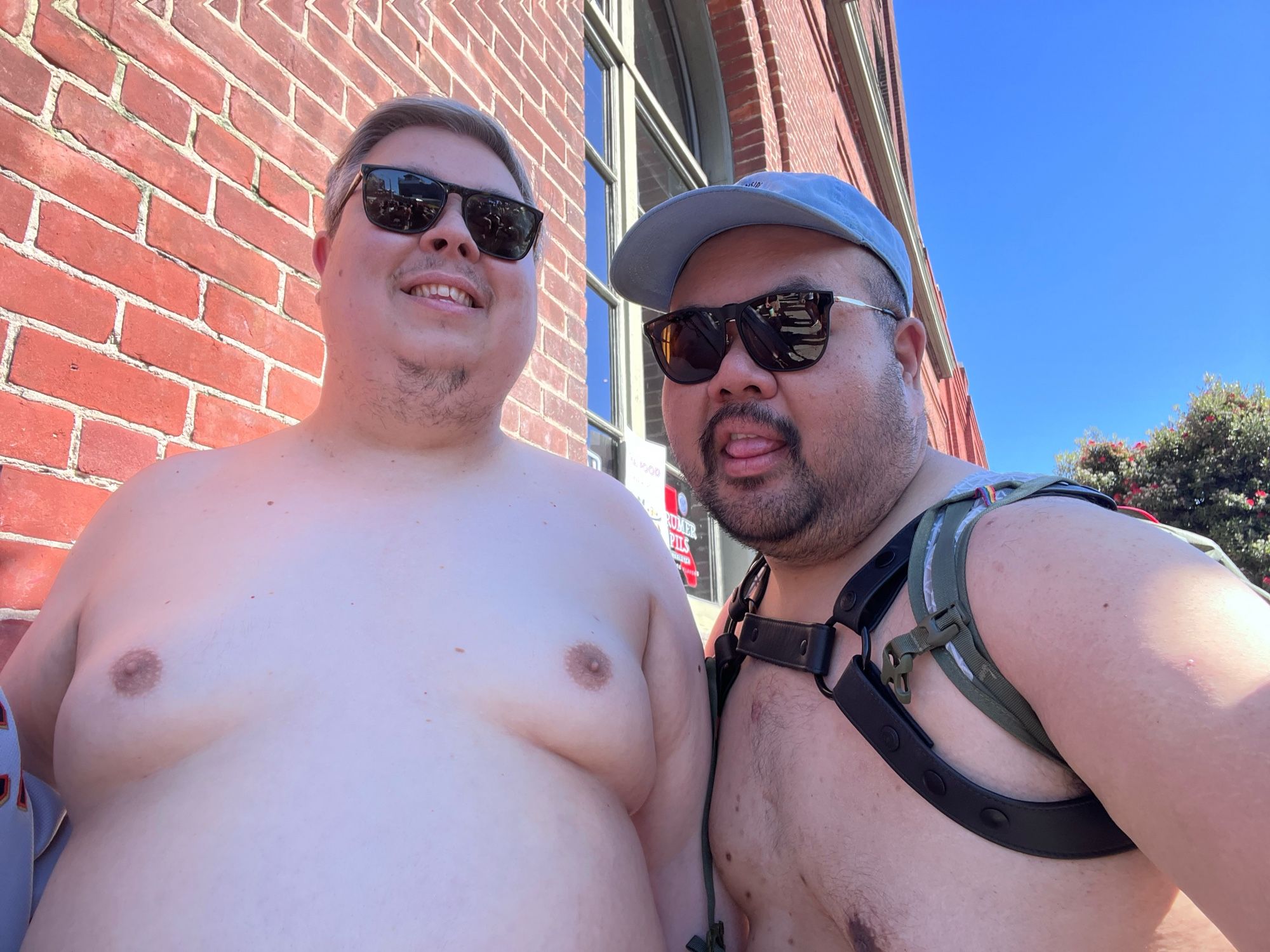 Brandon and I shirtless. I'm wearing my harness.