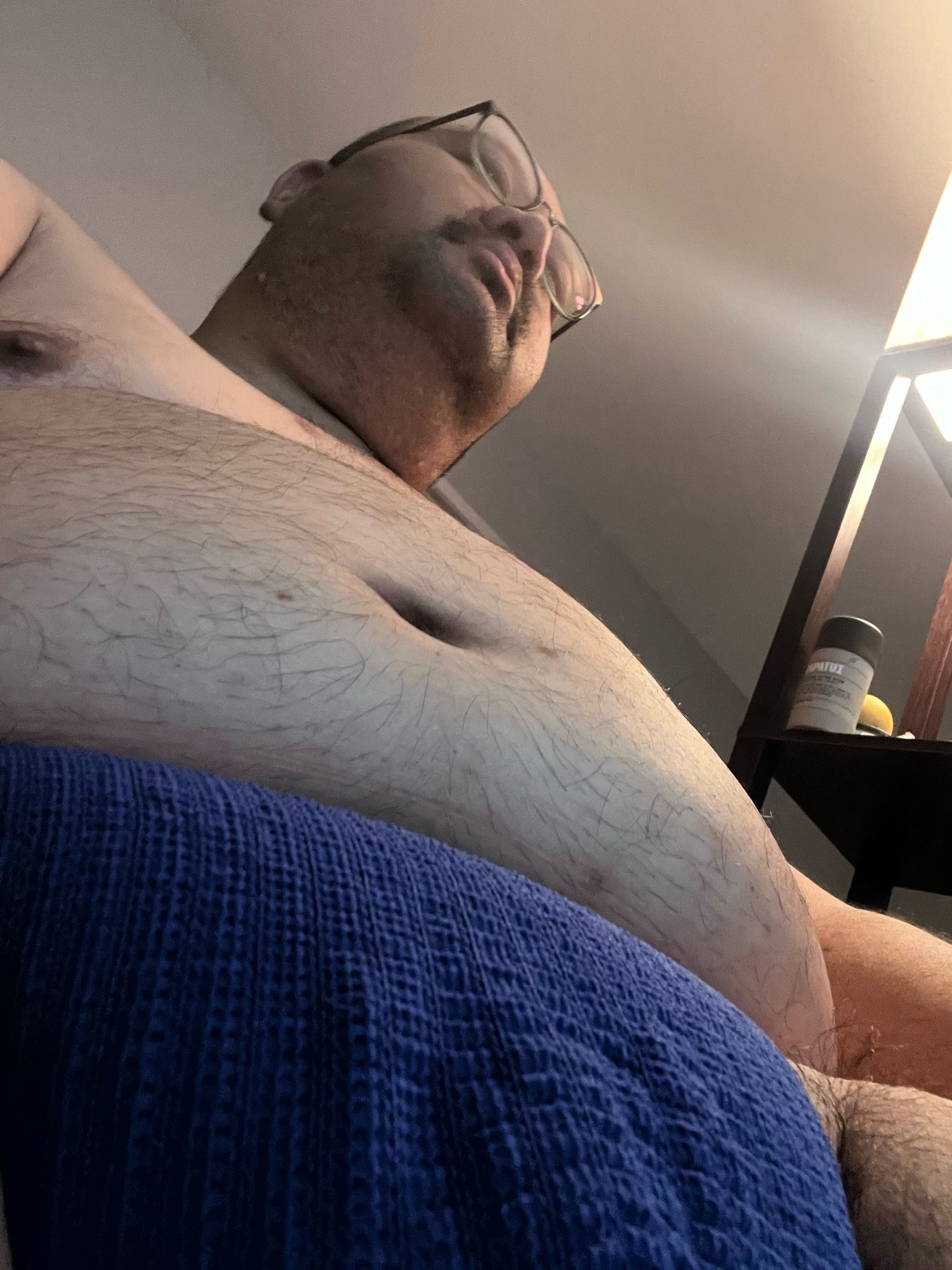 View from below. You can see my jockstrap my belly and my face.