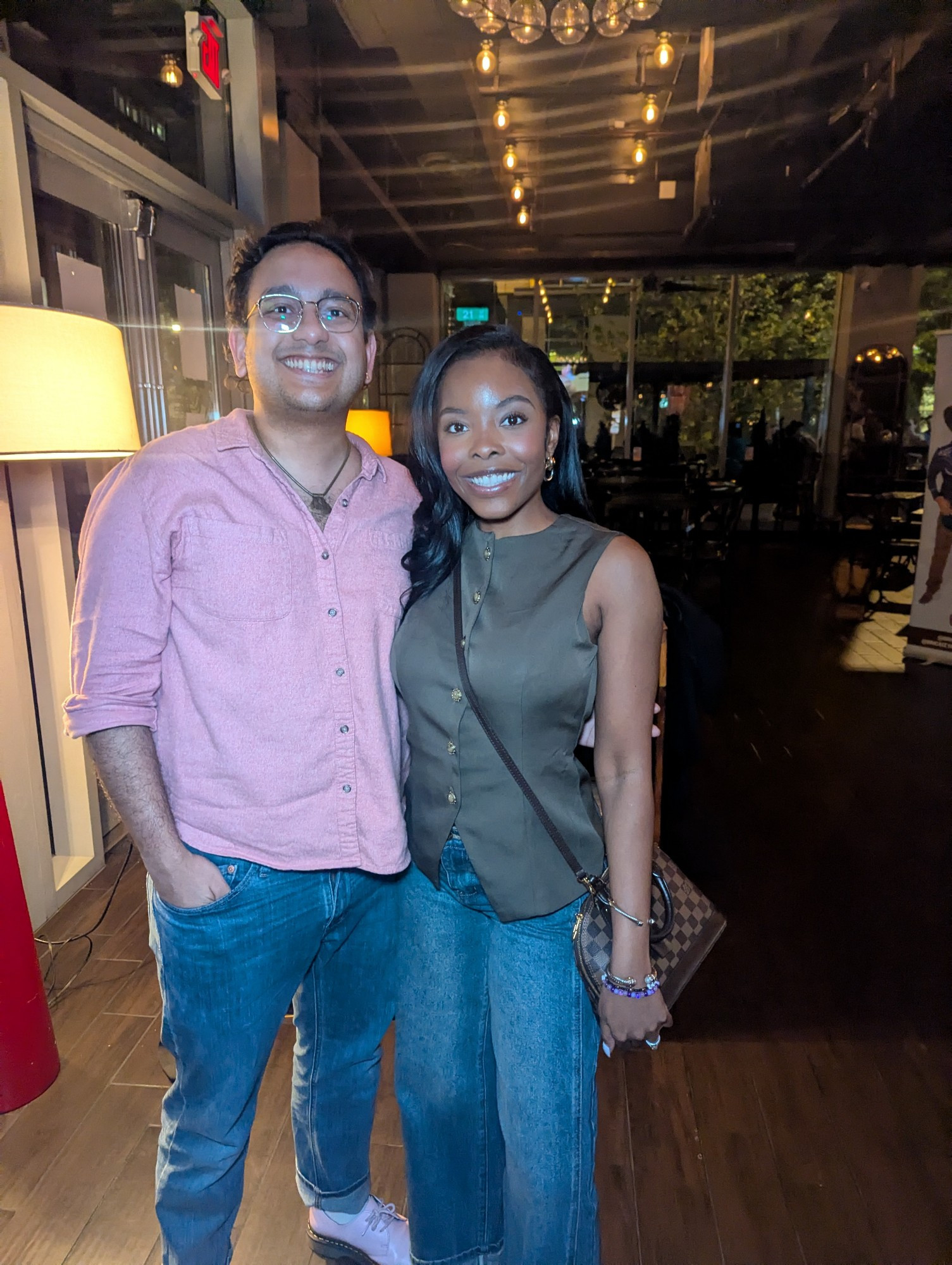 user biguyreacts with Big Brother legend Mecole Hayes at a bar in DC