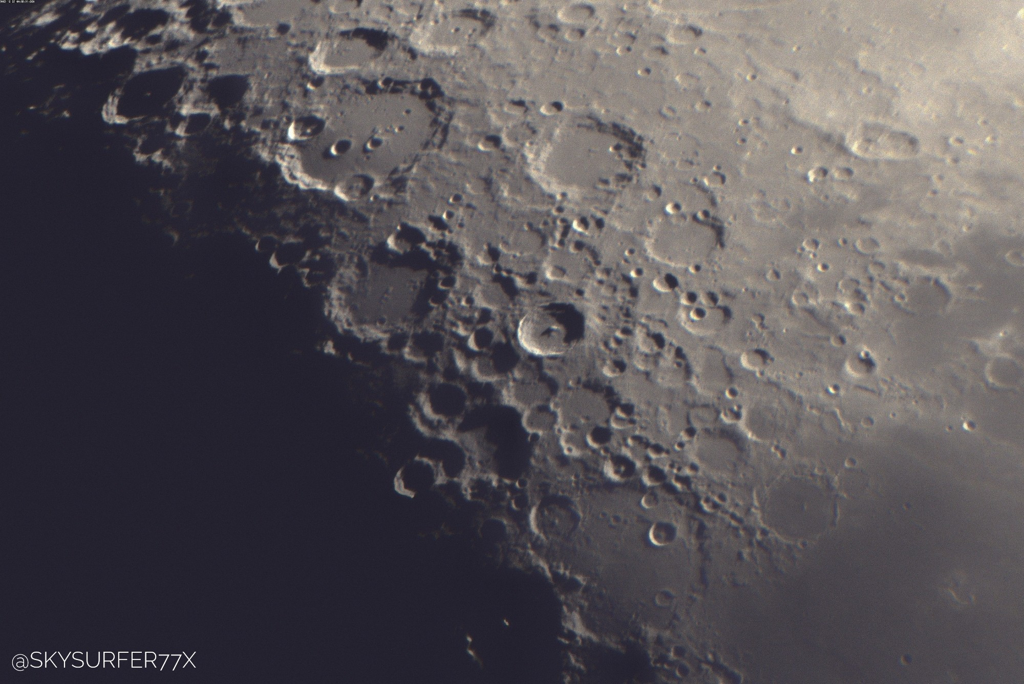 A close up view of the moon surface, showing craters in nice detail