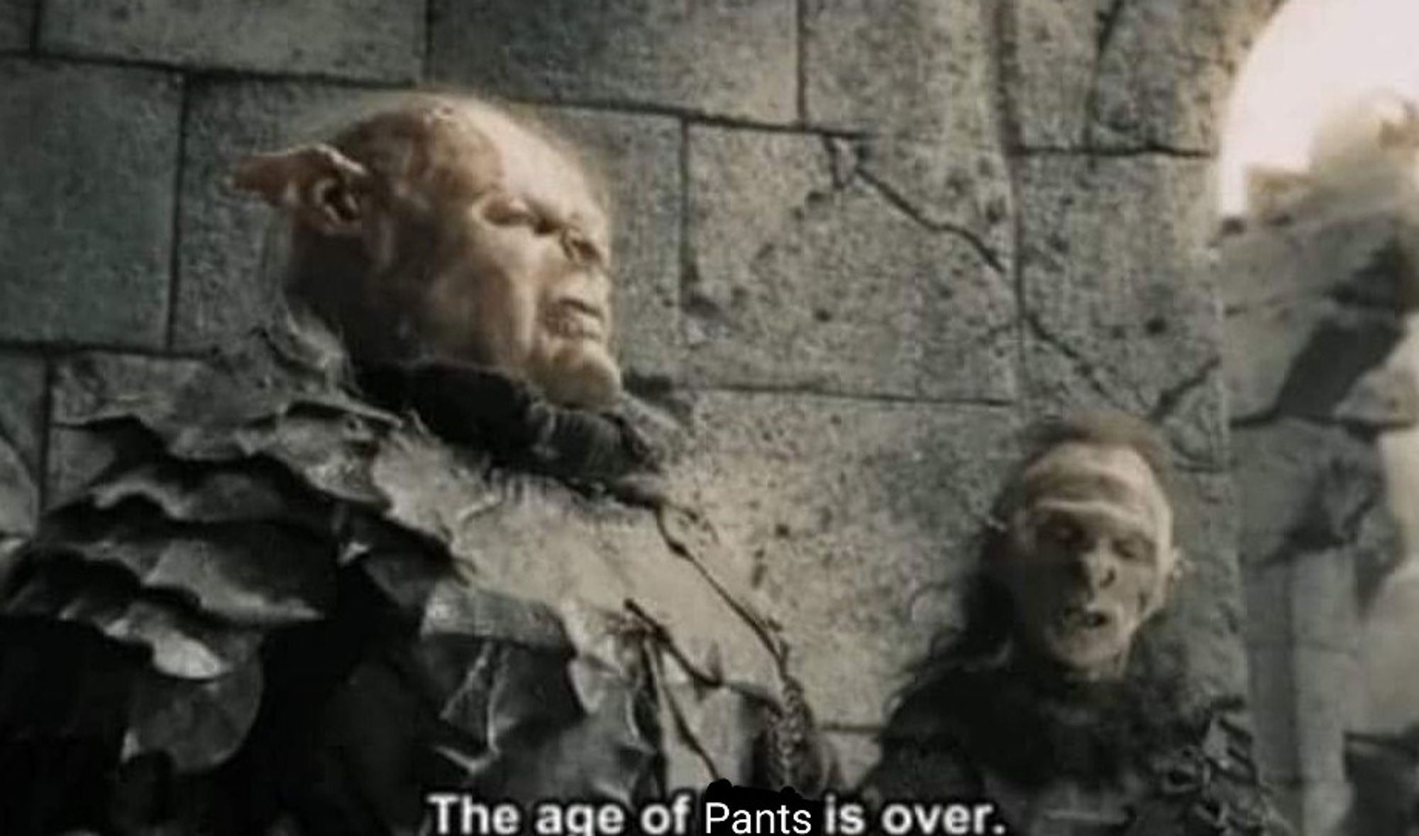 A still from Lord of the Rings. Gothmog, a grotesque orc war leader, is issuing a grand proclamation. (He looks exactly like Harvey Weinstein and this resemblance is intentional on the part of the filmmakers.) 

Subtitle: The age of pants is over.