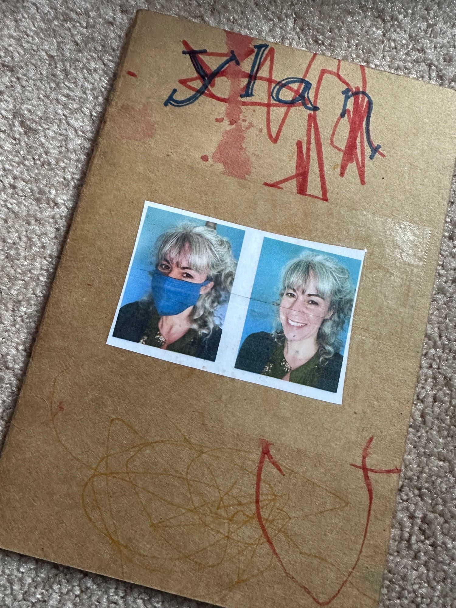 Rectangular notebook, with toddler scribbles. Photos of a teacher. One is masked, one without a mask. Teacher is smiling.